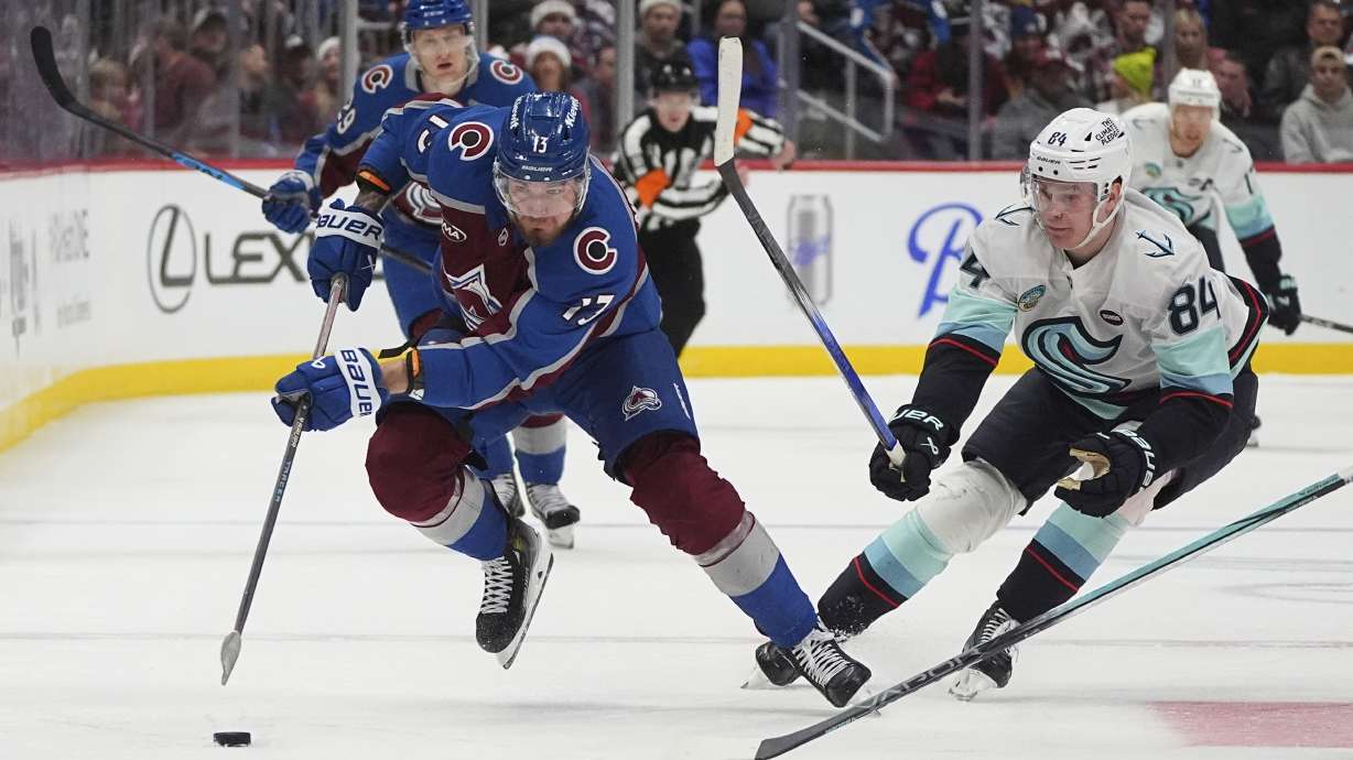 FILE - Colorado Avalanche right wing Valeri Nichushkin (13) and Seattle Kraken right wing Kaapo Kakko (84) in the third period of an NHL hockey game, Dec. 22, 2024, in Denver.