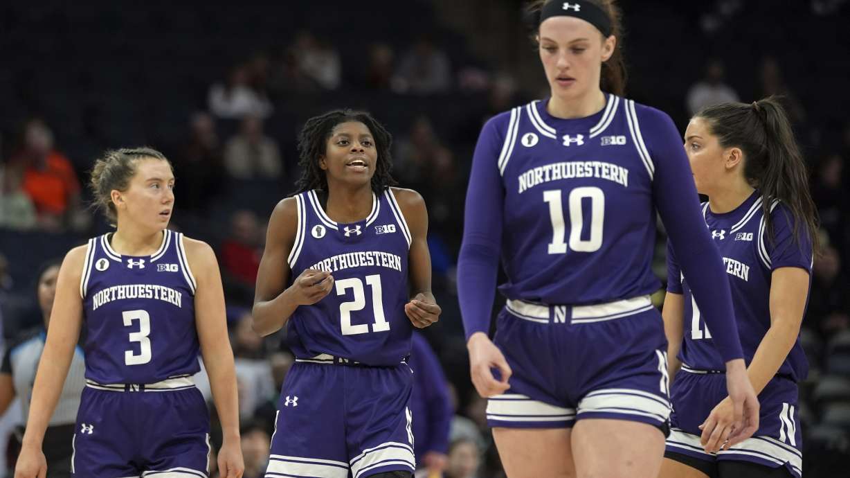 FILE - Northwestern guards Maggie Pina (3), Melannie Daley (21), forward Caileigh Walsh (10) and guard Casey Harter walk down the court during the second half of an NCAA college basketball game against Purdue at the Big Ten women's tournament, March 6, 2024, in Minneapolis.