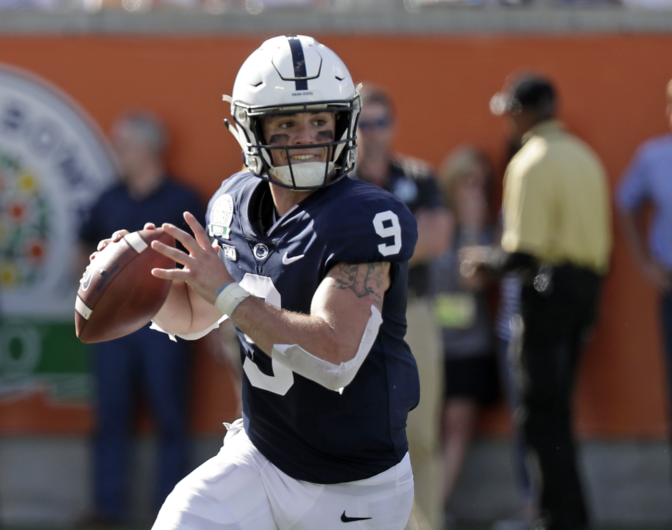 FILE - Penn State quarterback Trace McSorley looks for a receiver against Kentucky during the first half of the Citrus Bowl NCAA college football game, Jan. 1, 2019, in Orlando, Fla. 