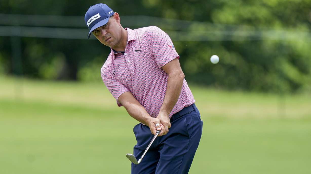 FILE - Gary Woodland chips to the seventh green during the first round of the Charles Schwab Challenge golf tournament at Colonial Country Club, Thursday, May 23, 2024, in Fort Worth, Texas.