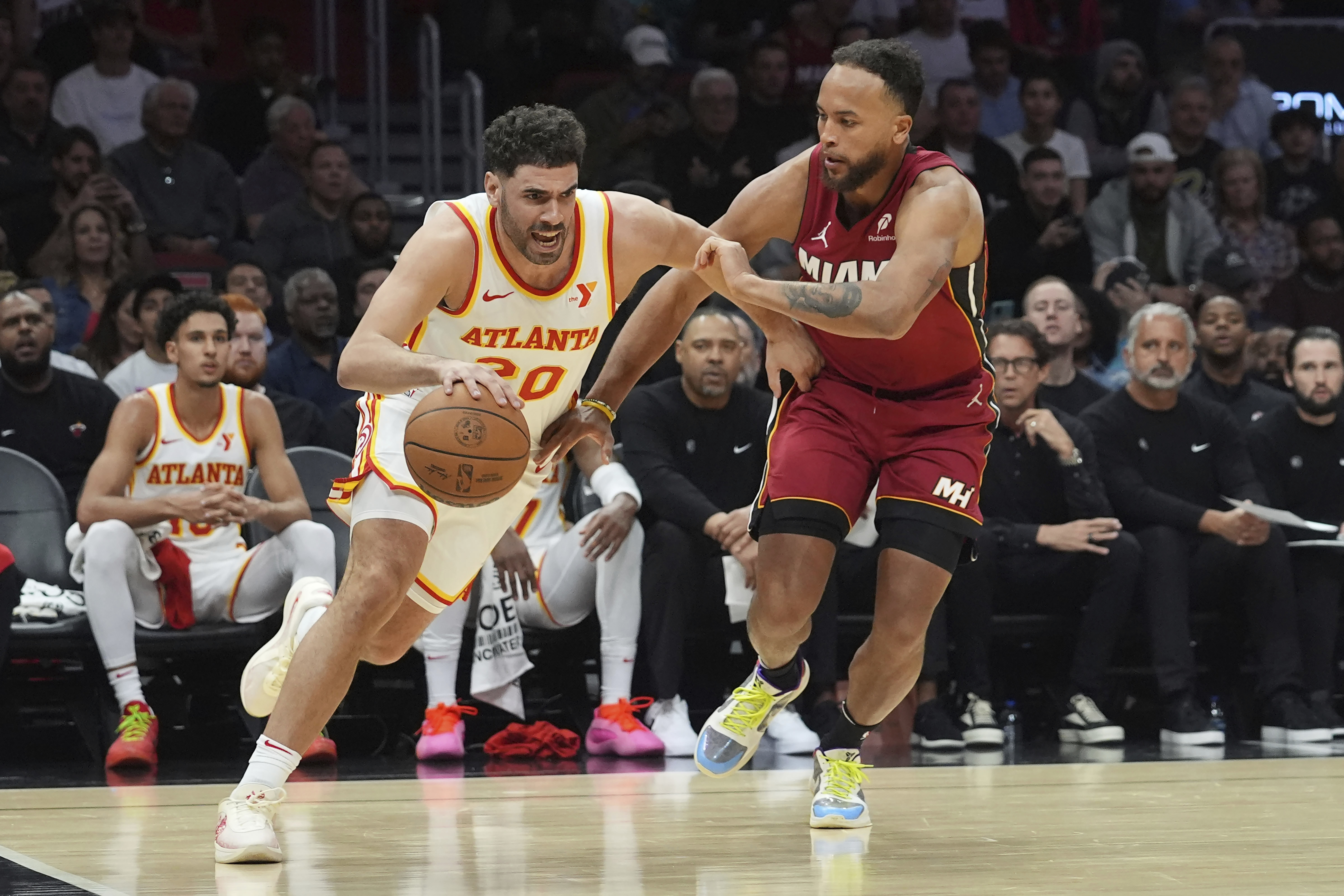 Miami Heat forward Kyle Anderson (20) defends Atlanta Hawks forward Georges Niang (20) during the first half of an NBA basketball game, Wednesday, Feb. 26, 2025, in Miami. 