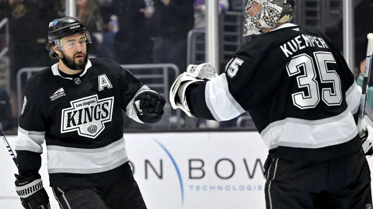 Los Angeles Kings defenseman Drew Doughty, left, fist pumps Kings goaltender Darcy Kuemper (35) after scoring a goal during the first period of an NHL hockey game against the Utah Hockey Club, Saturday, Feb. 22, 2025, in Los Angeles.