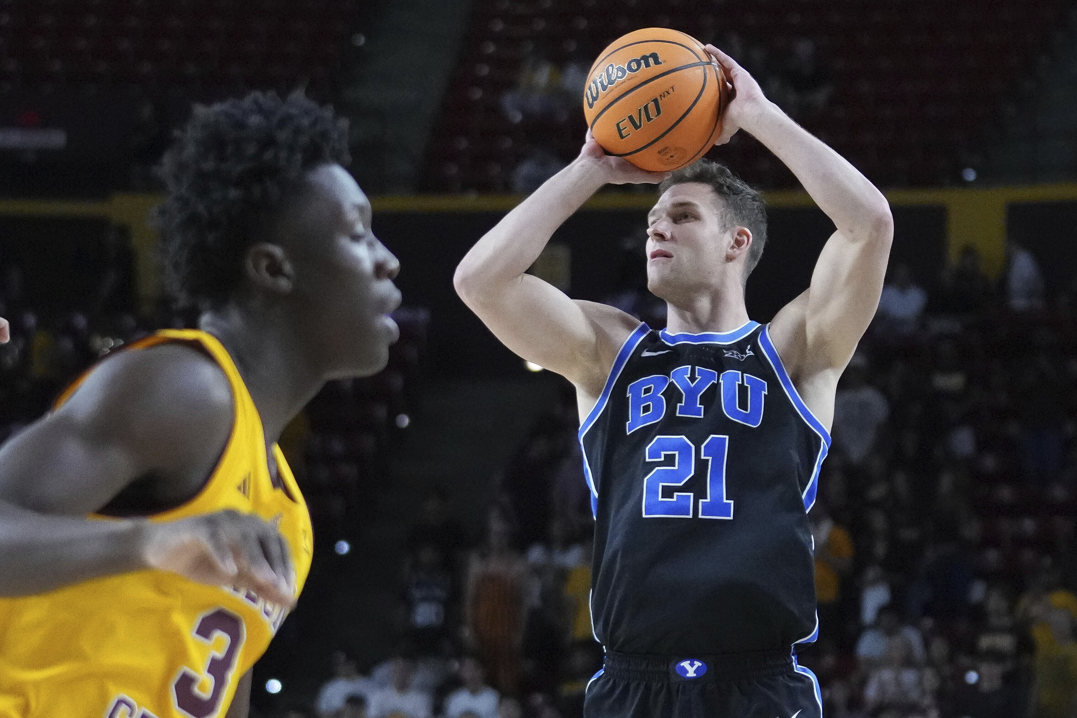 BYU guard Trevin Knell (21) shoots during the first half of an NCAA college basketball game against Arizona State, Wednesday, Feb. 26, 2025, in Tempe, Ariz.
