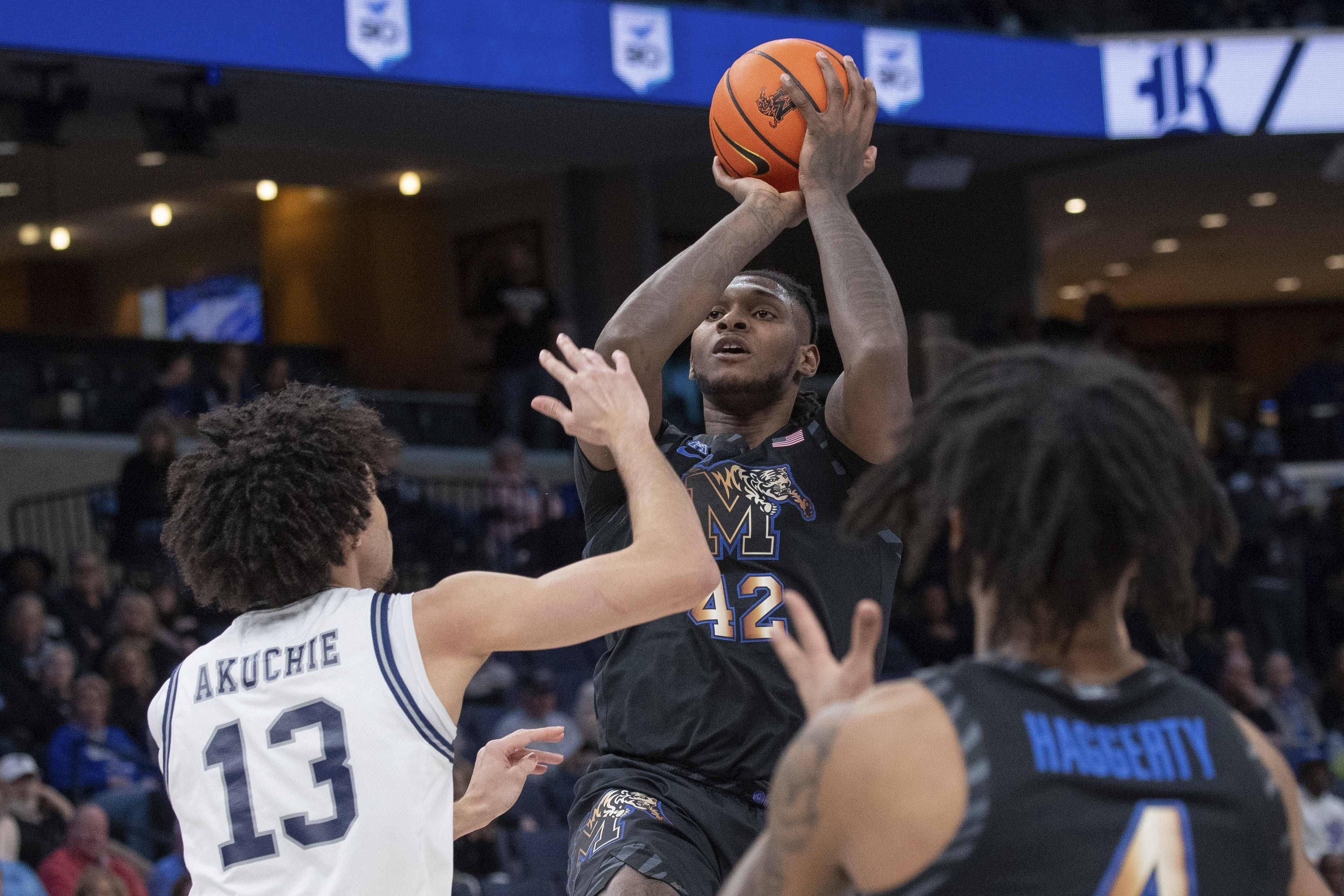 Memphis forward Dain Dainja (42) shoots defended by Rice forward Andrew Akuchie (13) during the first half of an NCAA college basketball game, Wednesday, Feb. 26, 2025, in Memphis, Tenn. 