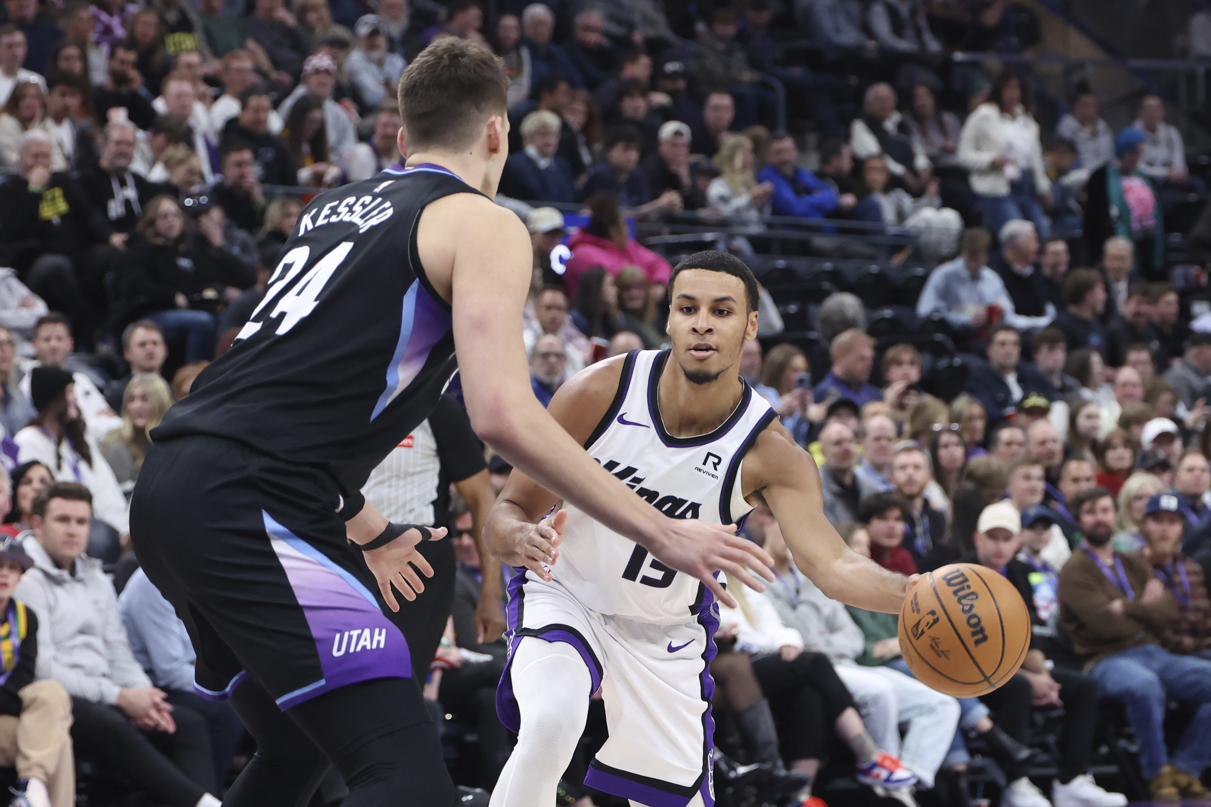 Sacramento Kings forward Keegan Murray (13) passes the ball as Utah Jazz center Walker Kessler (24) defends during the first half of an NBA basketball game, Wednesday, Feb. 26, 2025, in Salt Lake City.