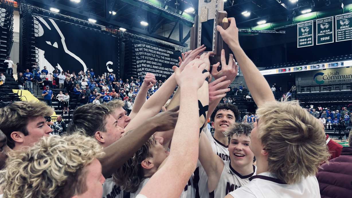 The Morgan Trojans receive their trophy as they are named the 2025 3A State Champions.