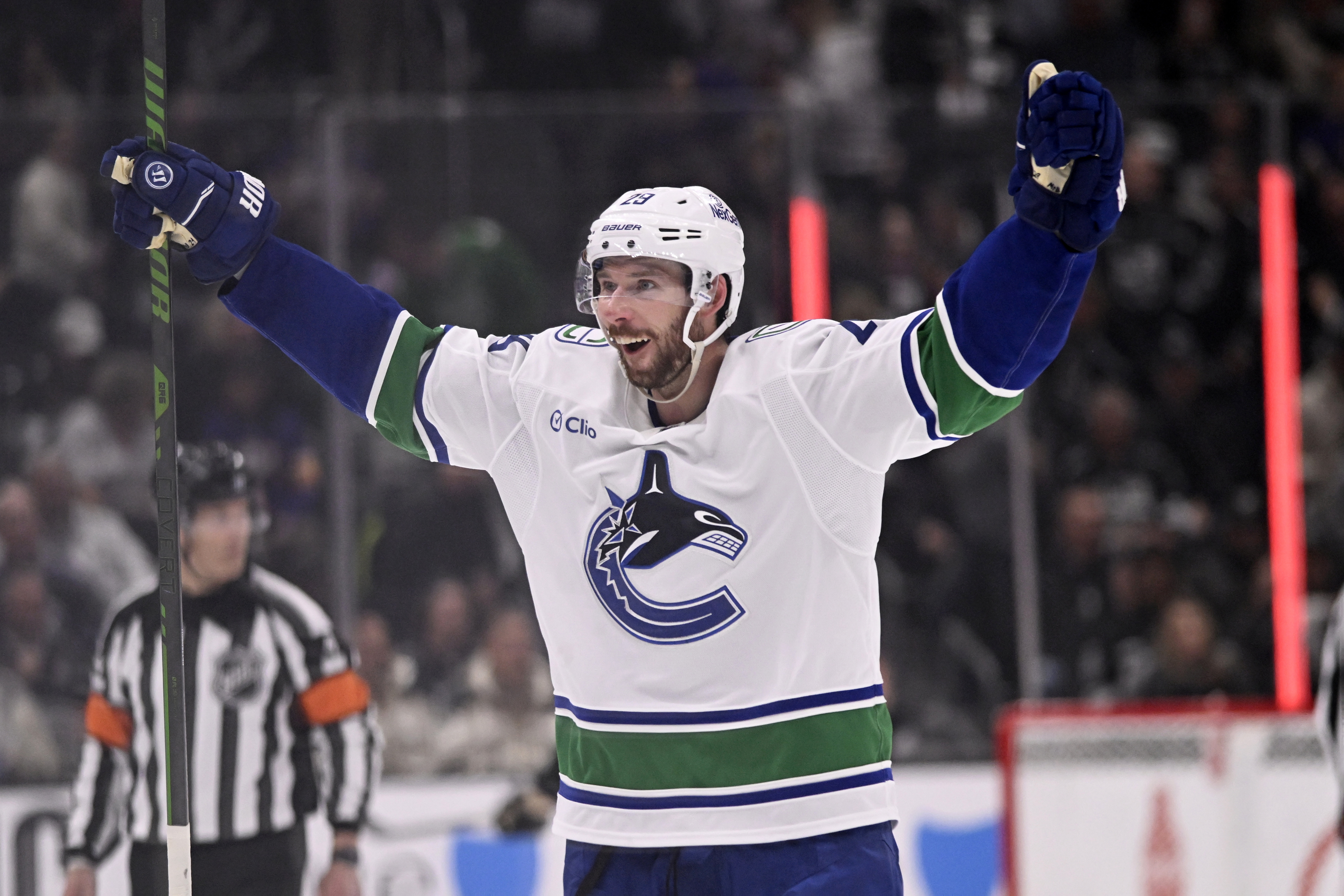 Vancouver Canucks defenseman Marcus Pettersson (29) celebrates after the Canucks score during overtime of an NHL hockey game against the Los Angeles Kings in Los Angeles, Wednesday, Feb. 26, 2025.