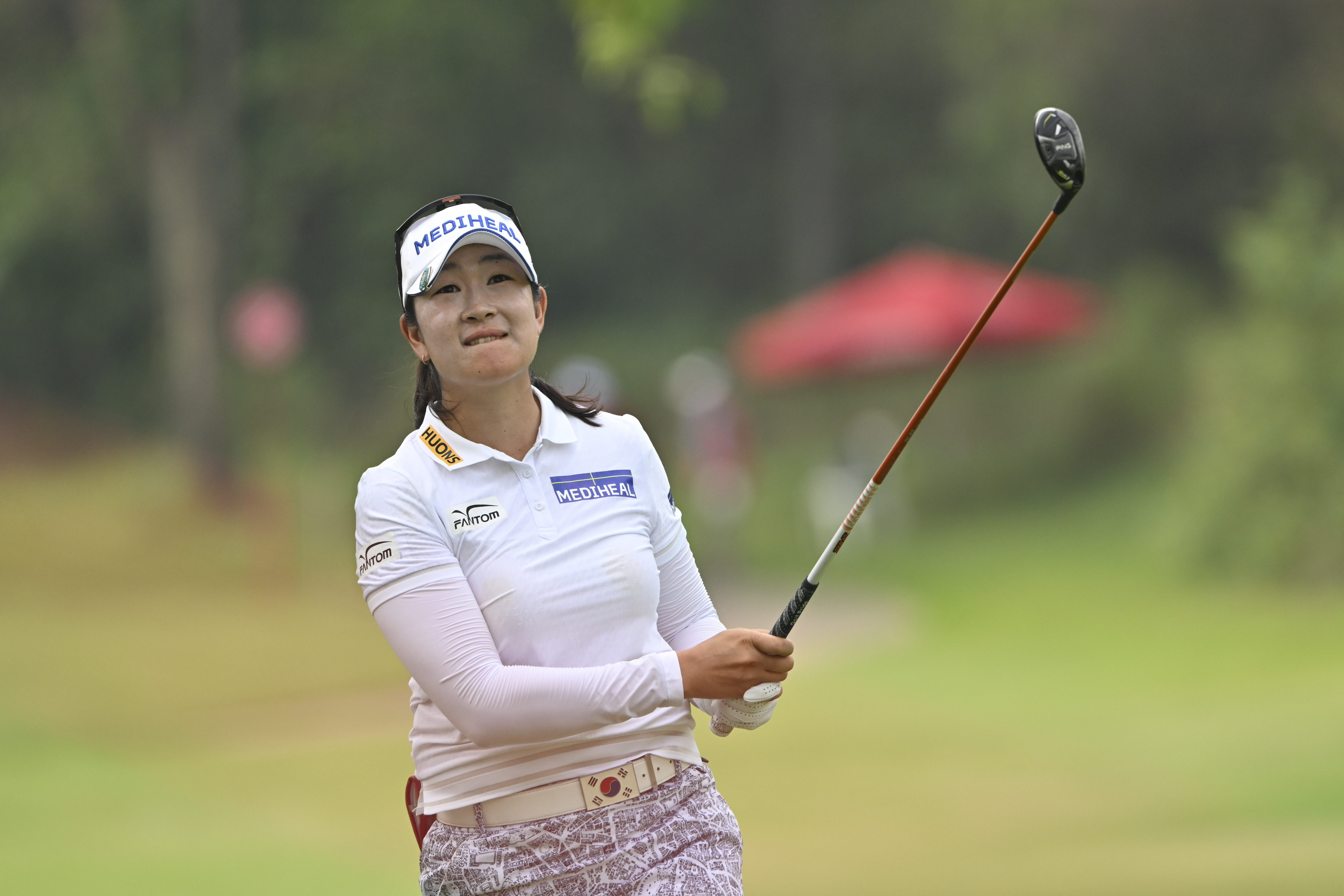 A Lim Kim of South Korea watches her shot on the 7th hole during the final round of the LPGA Honda Thailand golf tournament in Pattaya, southern Thailand, Sunday, Feb. 23, 2025.