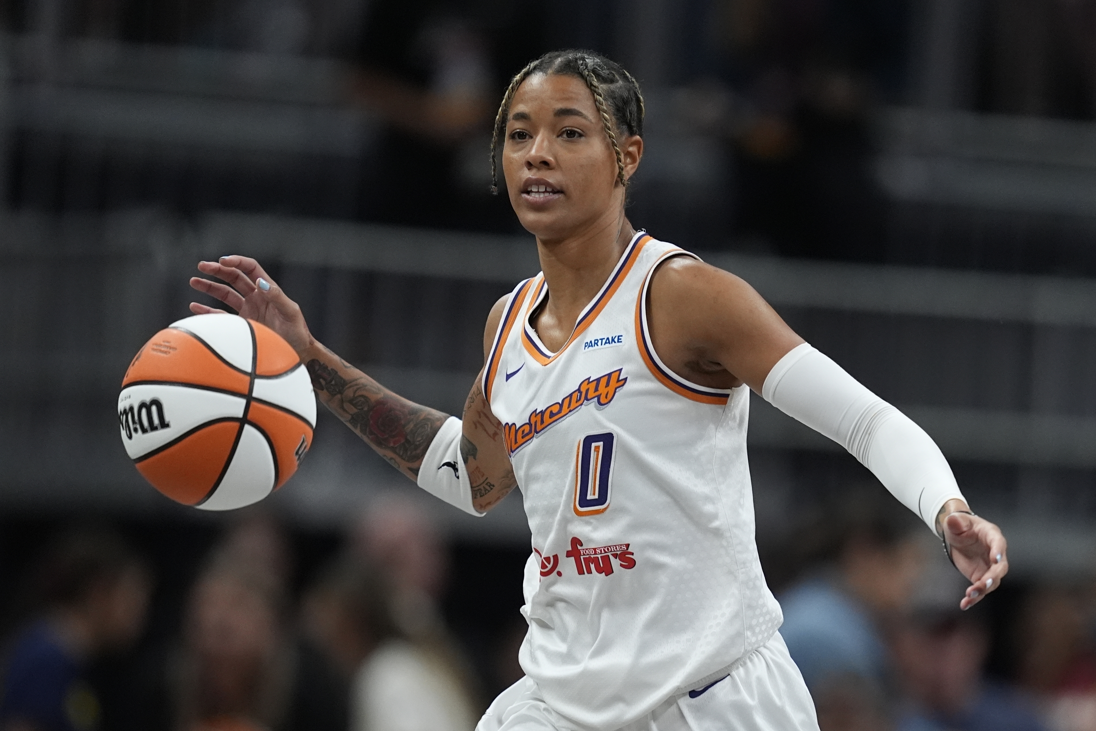FILE - Phoenix Mercury's Natasha Cloud dribbles during the first half of a WNBA basketball game against the Indiana Fever in Indianapolis, on Friday, Aug. 16, 2024.