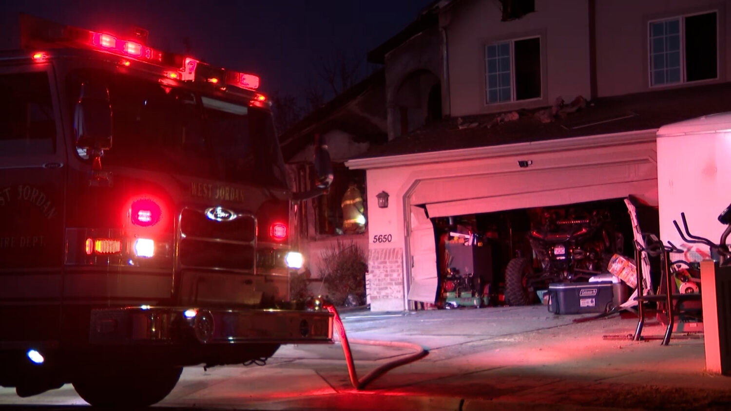 Crews respond to a house fire near 5600 West and 6700 South in West Jordan Wednesday. Two dogs died and one person was taken to a hospital for smoke inhalation.