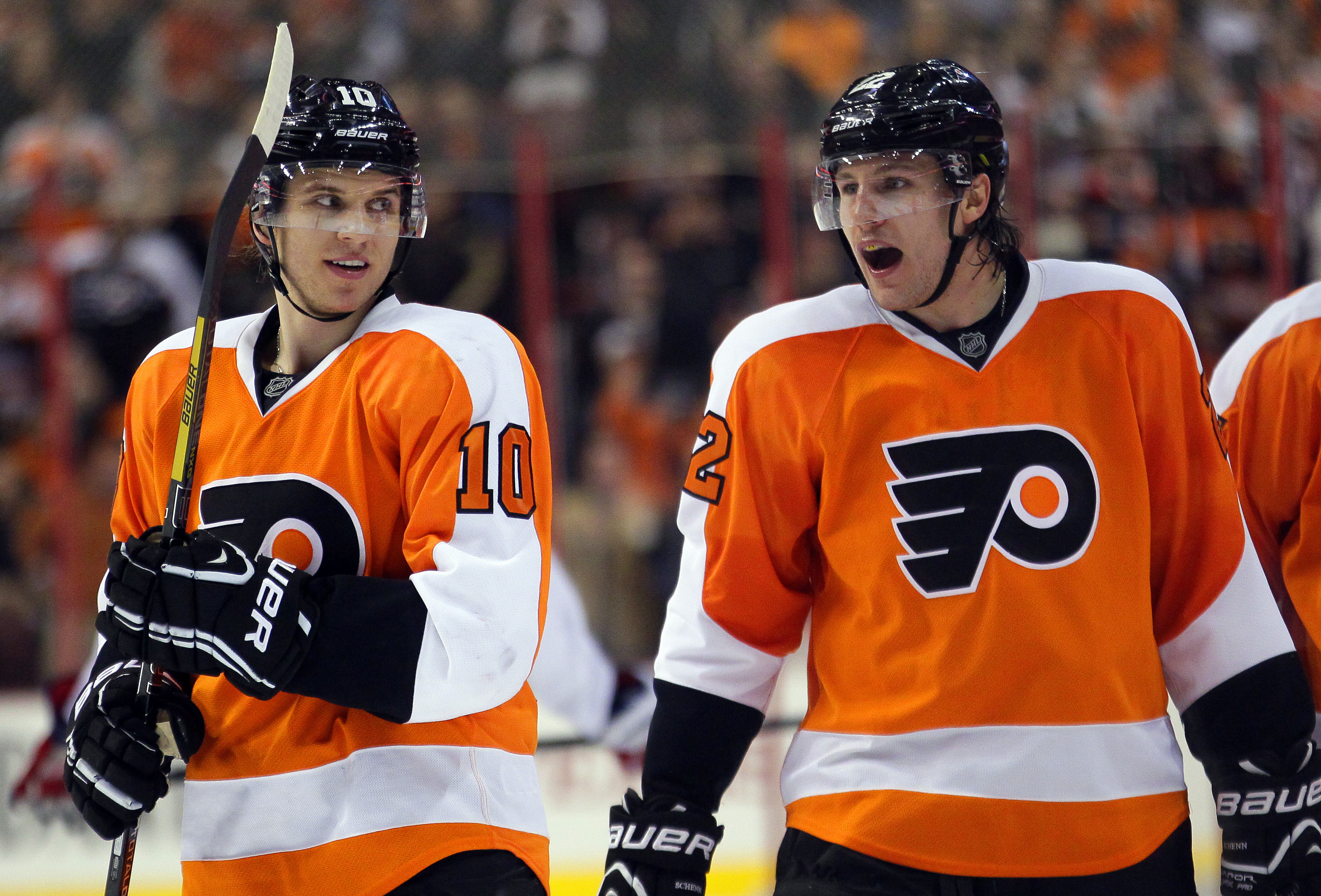 FILE - Philadelphia Flyers Brayden Schenn, left, looks towards his brother Luke, right, who shouts out after getting an assist on Max Talbot's goal in the second period of an NHL hockey game with the Washington Capitals, Feb 27, 2013, in Philadelphia. 