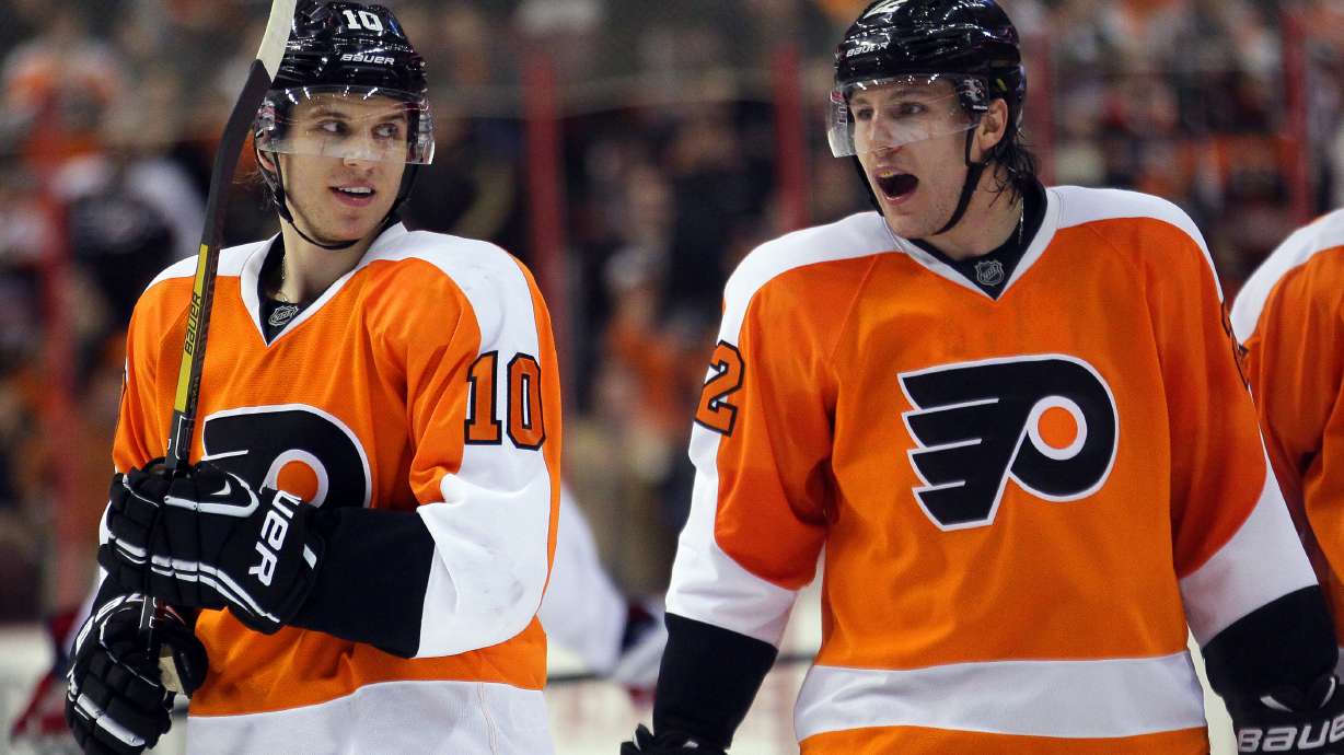 FILE - Philadelphia Flyers Brayden Schenn, left, looks towards his brother Luke, right, who shouts out after getting an assist on Max Talbot's goal in the second period of an NHL hockey game with the Washington Capitals, Feb 27, 2013, in Philadelphia.