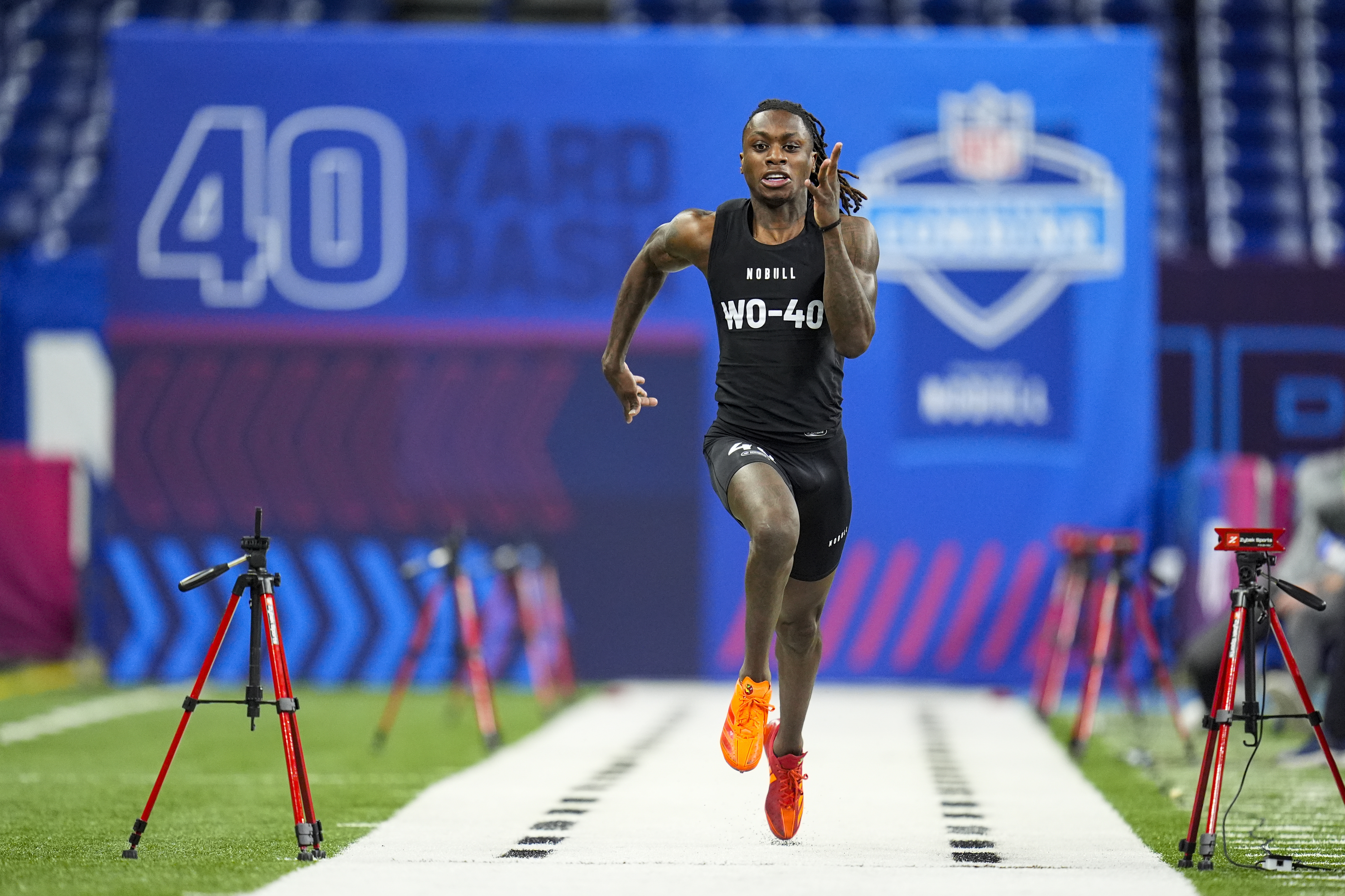 FILE - Texas wide receiver Xavier Worthy runs the 40-yard dash at the NFL football scouting combine, Saturday, March 2, 2024, in Indianapolis. 