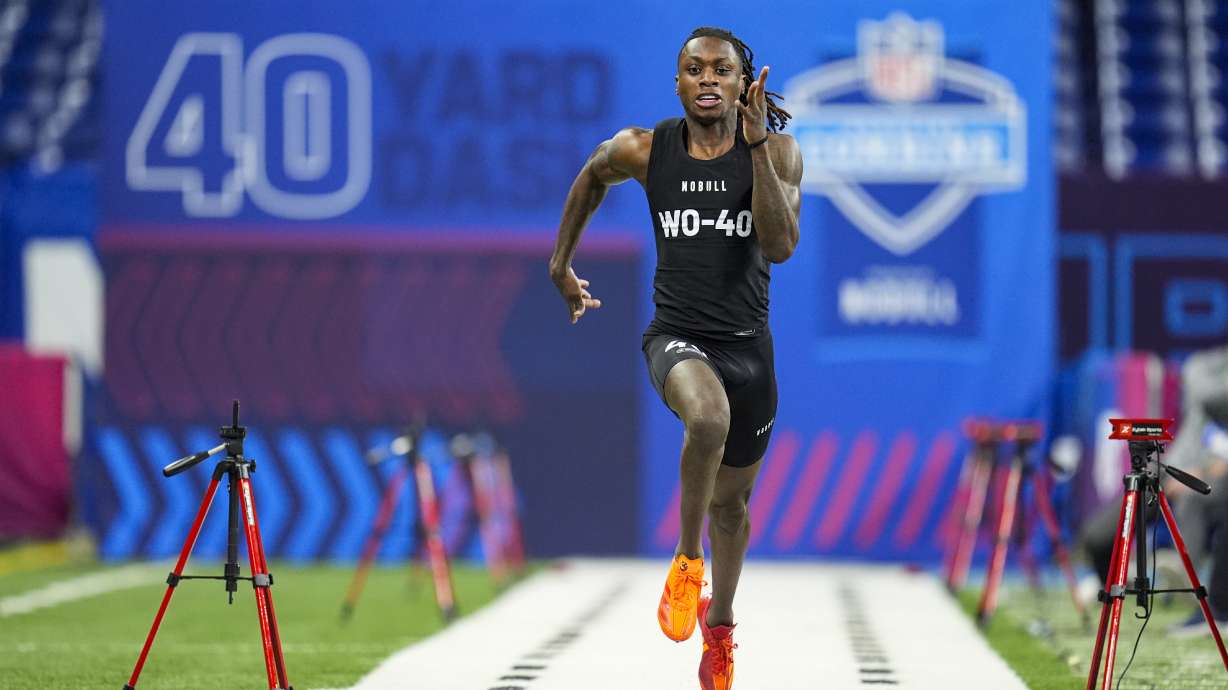 FILE - Texas wide receiver Xavier Worthy runs the 40-yard dash at the NFL football scouting combine, Saturday, March 2, 2024, in Indianapolis.