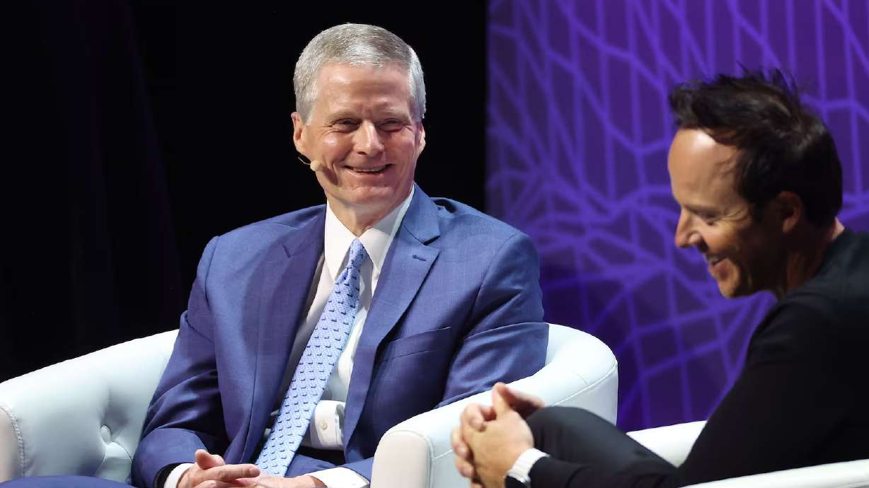 Elder David A. Bednar, of Quorum of the Twelve Apostles of The Church of Jesus Christ of Latter-day Saints, talks with Utah Jazz owner Ryan Smith at the eighth annual Silicon Slopes Summit at the Delta Center on Sept. 28, 2023.