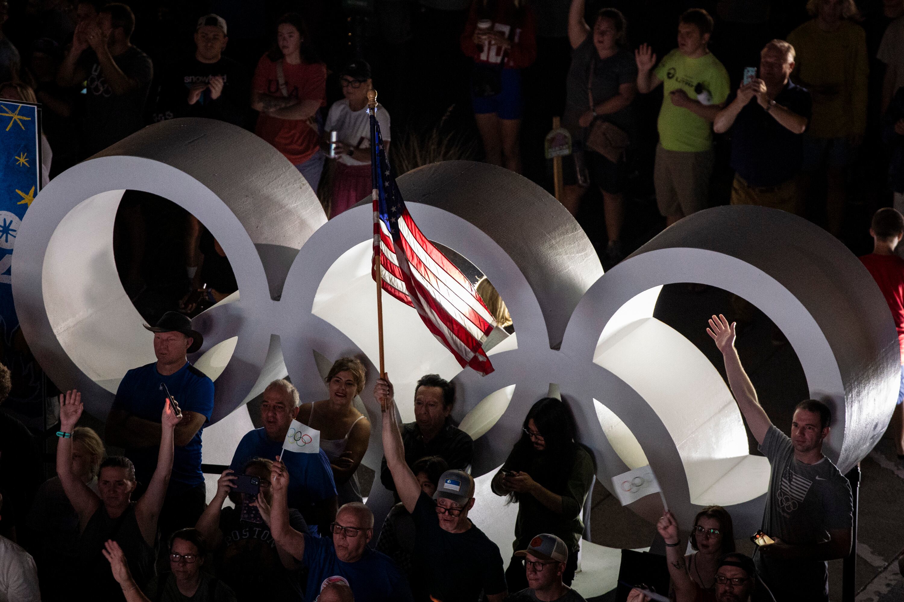 Attendees watch during a live watch party for the Salt Lake City-Utah Committee’s 2034 Winter Olympics bid held at the Salt Lake City and County Building in Washington Square Park on July 24, 2024, in downtown Salt Lake City.