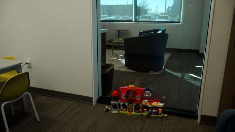 An interview room for children at the Murray City Police Department is separated from an adult interview room by a large soundproof window.