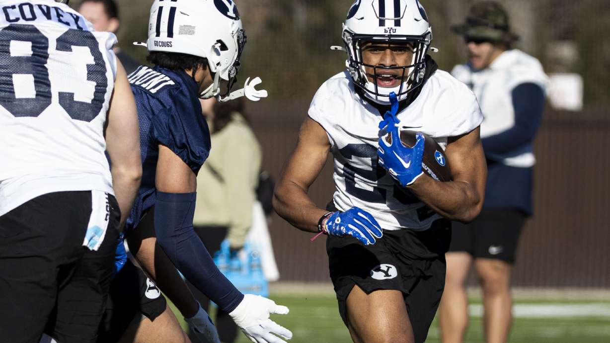 BYU running back Jovesa Damuni (28) runs the ball during the opening day of BYU football spring camp held at the Zions Bank Practice Fields of the Student Athlete Building on the campus of Brigham Young University in Provo on Thursday, Feb. 27, 2025.