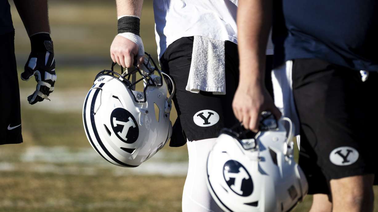 BYU players make their way off the field after the opening day of BYU football spring camp held at the Zions Bank Practice Fields of the Student Athlete Building on the campus of Brigham Young University in Provo on Thursday, Feb. 27, 2025.