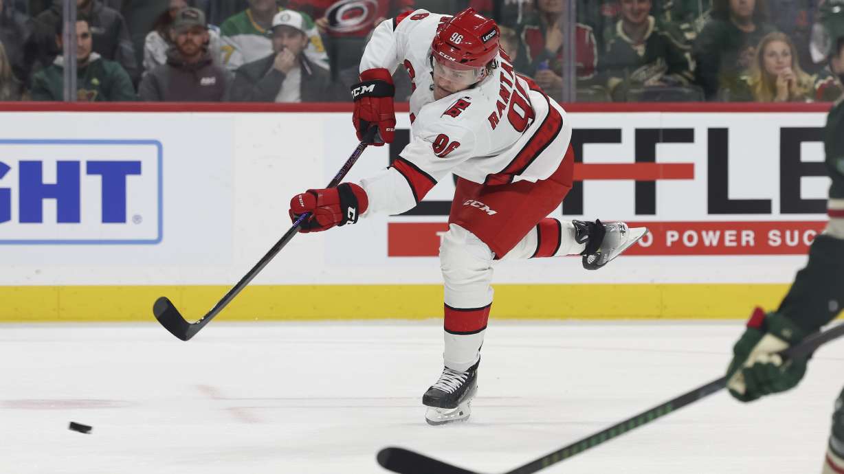 Carolina Hurricanes right wing Mikko Rantanen (96) shoots the puck against the Minnesota Wild during the second period of an NHL hockey game Thursday, Feb. 6, 2025, in St. Paul, Minn.