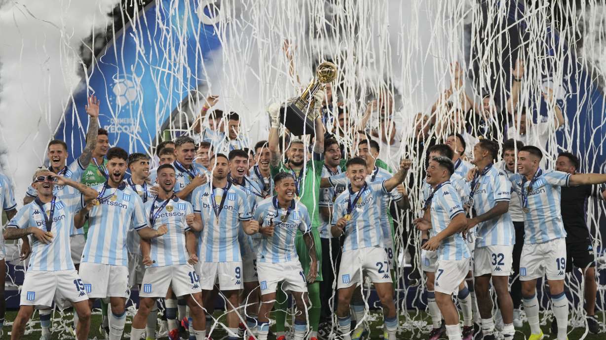 Players of Argentina's Racing Club celebrate with the Recopa Sudamericana trophy after beating Brazil's Botafogo in the final soccer match, in Rio de Janeiro, Thursday, Feb. 27, 2025.