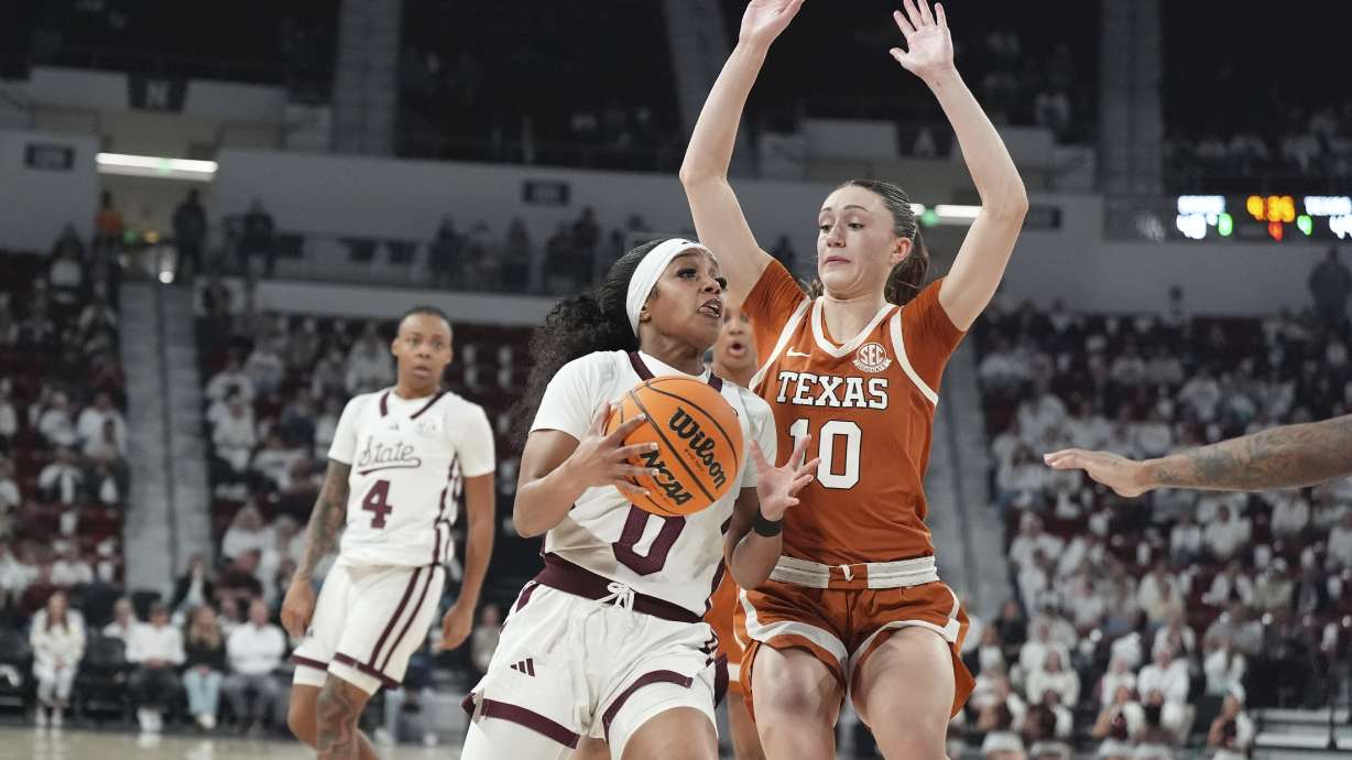 Mississippi State guard Denim DeShields (0) is guarded by Texas guard Shay Holle (10) during the second half of an NCAA college basketball game, Thursday, Feb. 27, 2025, in Starkville, Miss.