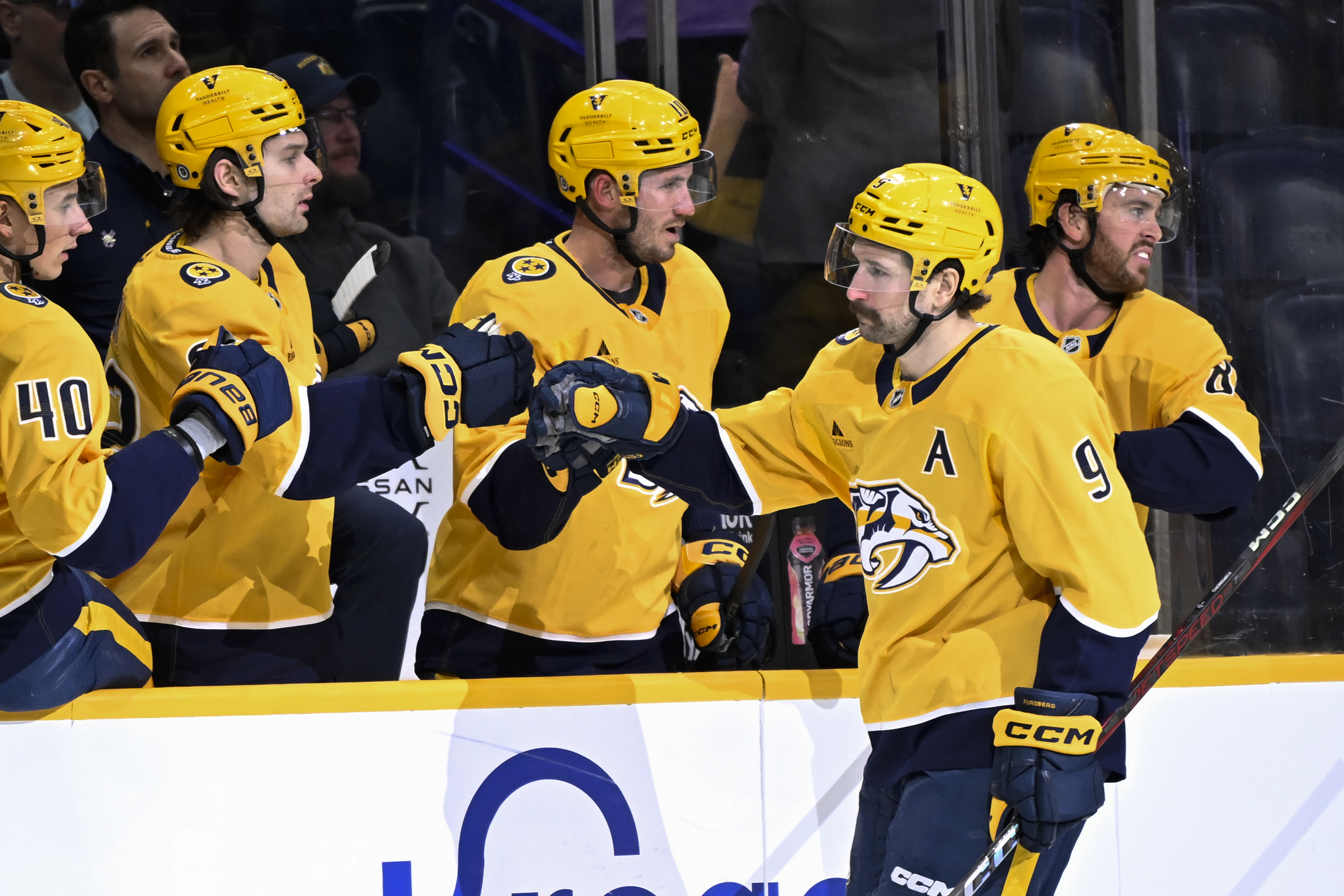 Nashville Predators left wing Filip Forsberg (9) is congratulated for his goal against the Winnipeg Jets during the first period of an NHL hockey game Thursday, Feb. 27, 2025, in Nashville, Tenn. 