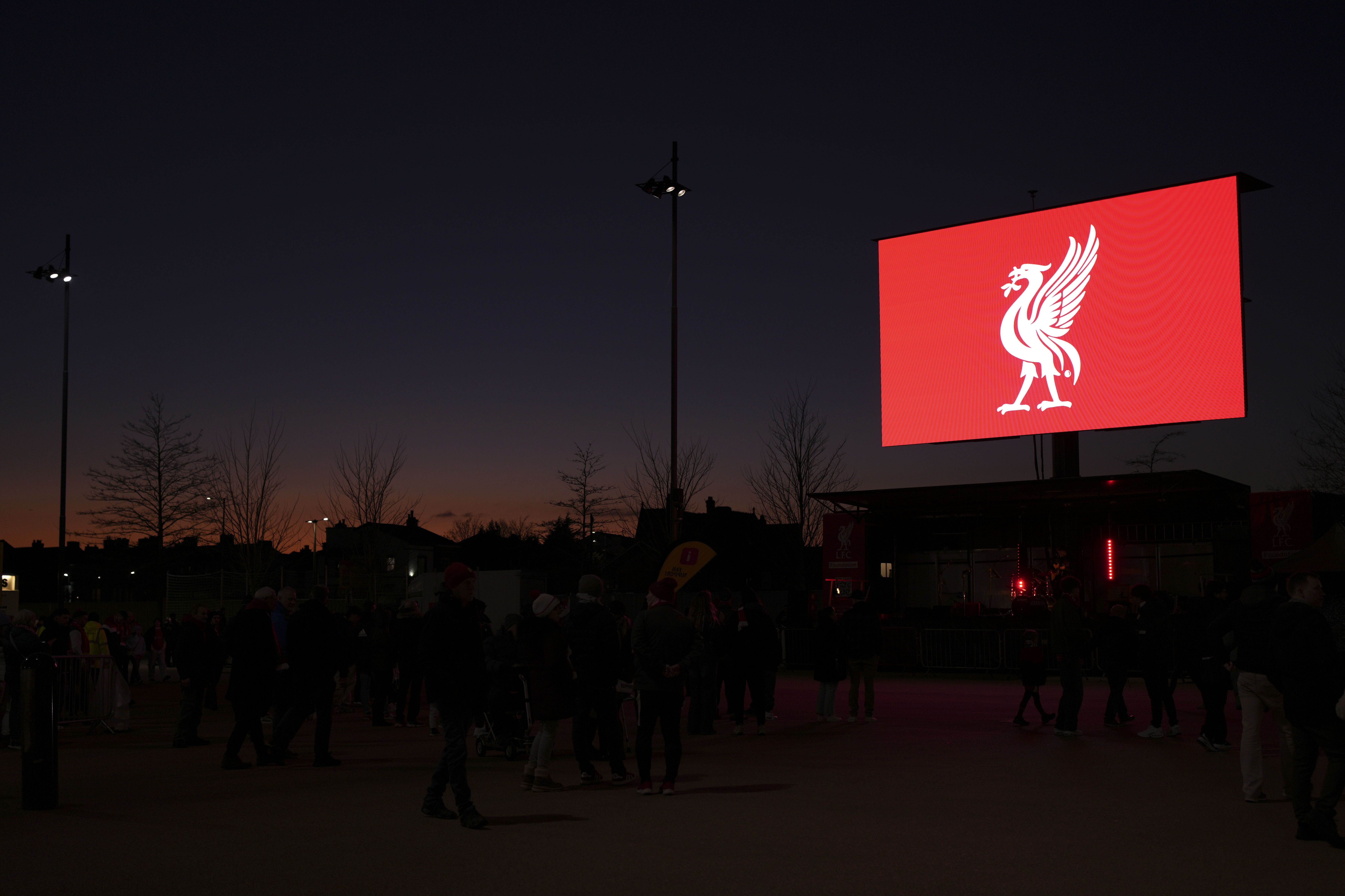 The Liverpool crest is displayed outside Anfield Stadium in Liverpool, England, as sunsets on Thursday, Feb. 6, 2025 before the English League Cup semifinal second leg soccer match between Liverpool and Tottenham Hotspur. 