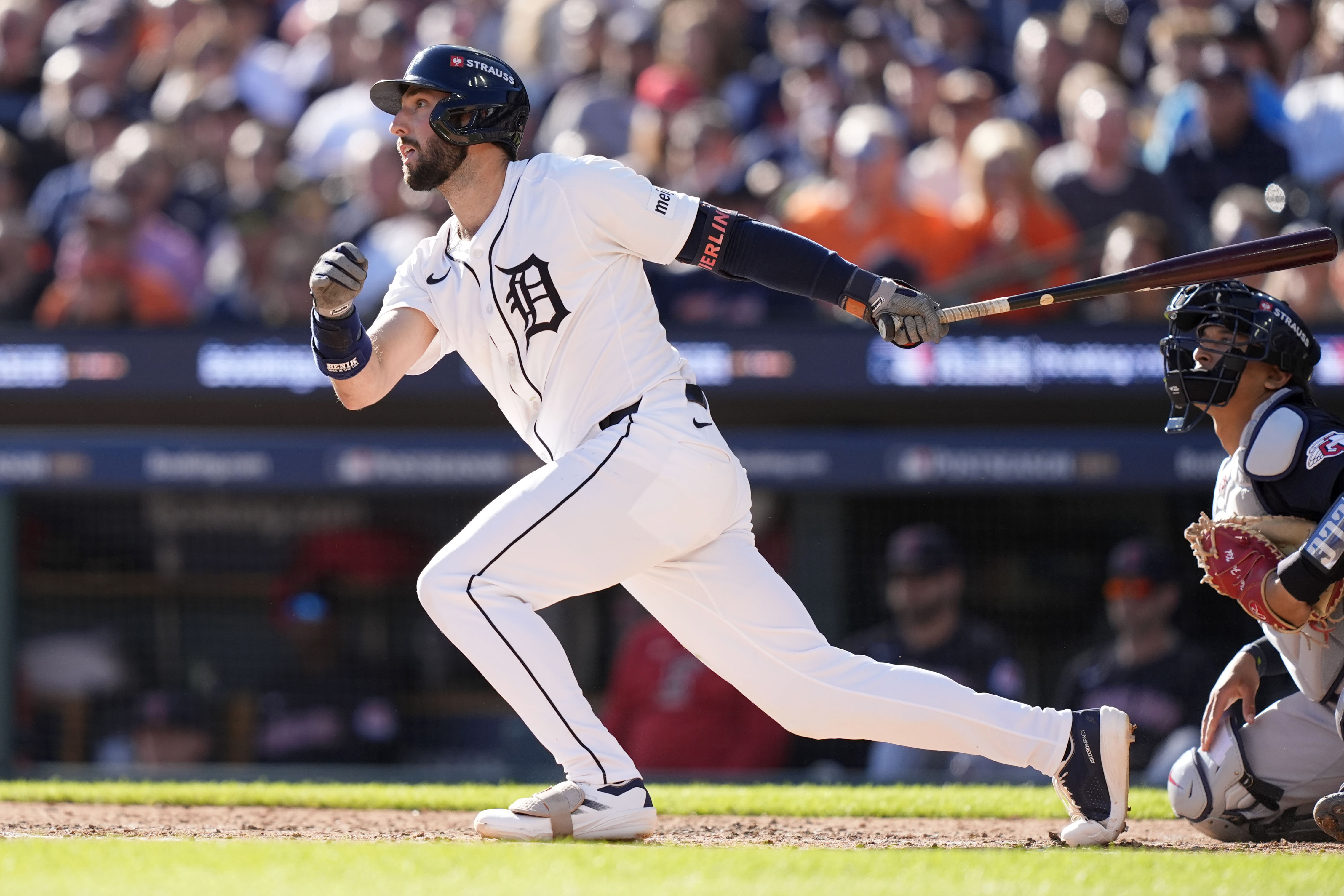 FILE - Detroit Tigers' Matt Vierling hits a sacrifice fly ball to score Jake Rogers in the third inning during Game 3 of a baseball American League Division Series against the Cleveland Guardians, Oct. 9, 2024, in Detroit.