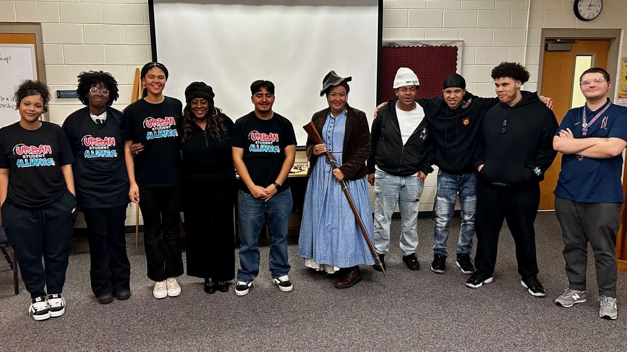 Cari Bartholomew dressed as Harriet Tubman, center, after a Feb. 20 Black History Month presentation to the Urban Student Alliance at Ben Lomond High School in Ogden.