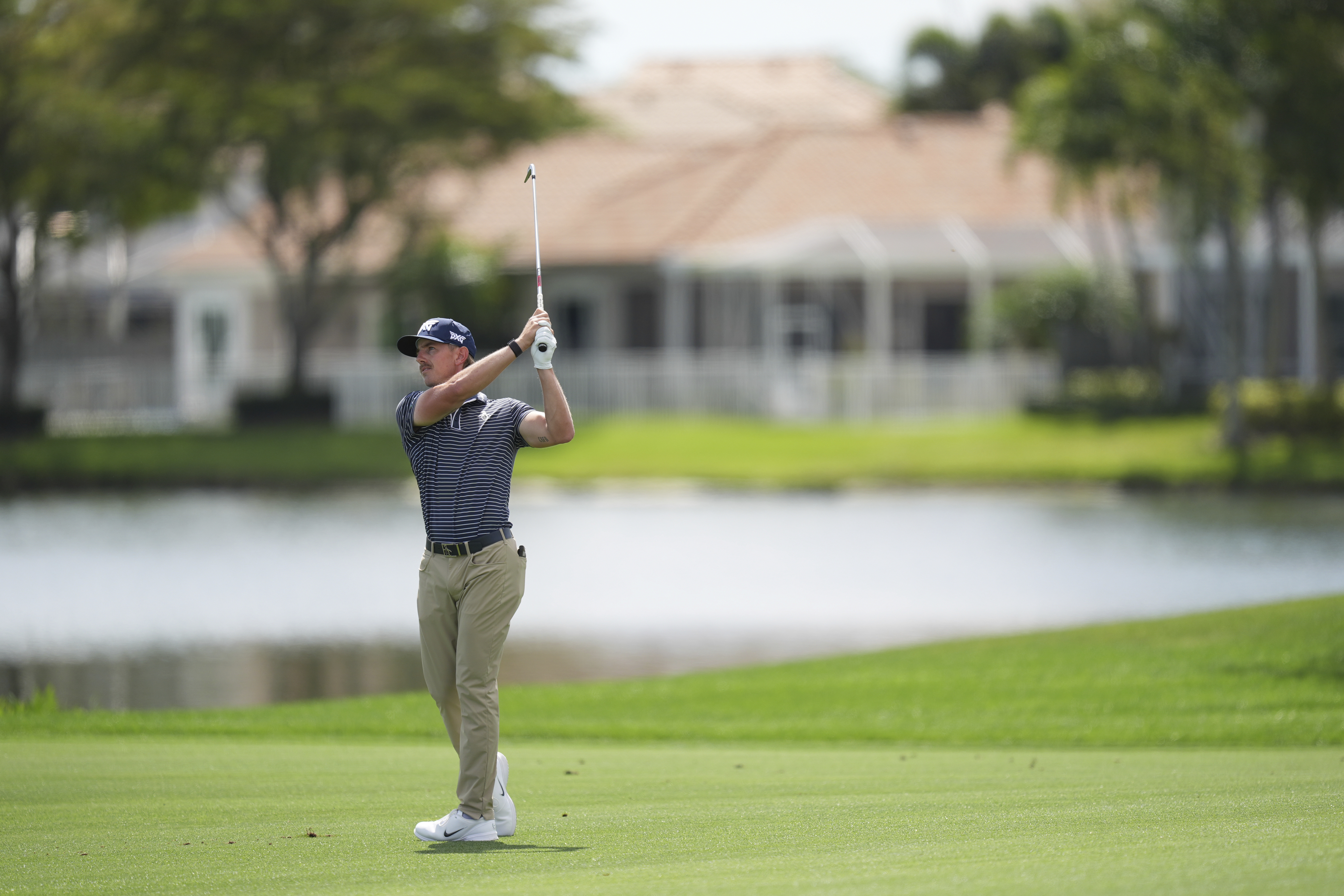 Jake Knapp hits on the 18th hole during the first round of the Cognizant Classic golf tournament, Thursday, Feb. 27, 2025, in Palm Beach Gardens, Fla.
