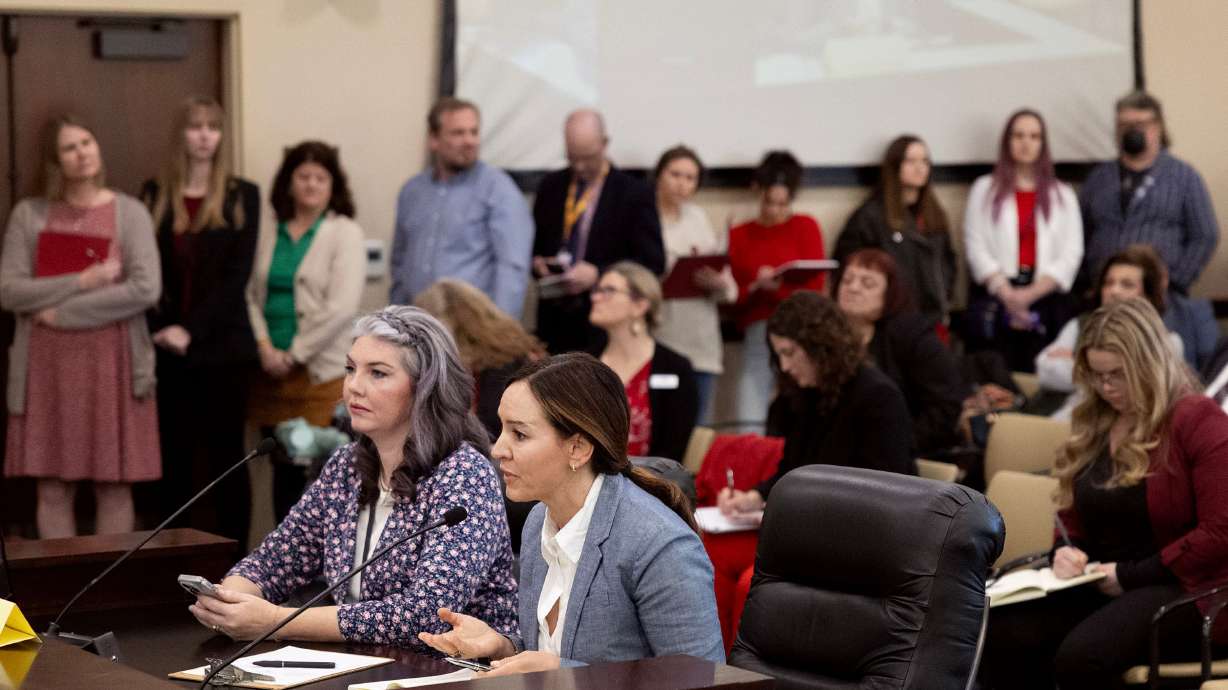 Marina Lowe speaks in opposition to HB77, Flag Display Amendments, as Corinne Johnson, left, waits to speak in favor of the bill in a Senate Education Committee meeting at the Capitol in Salt Lake City on Friday.