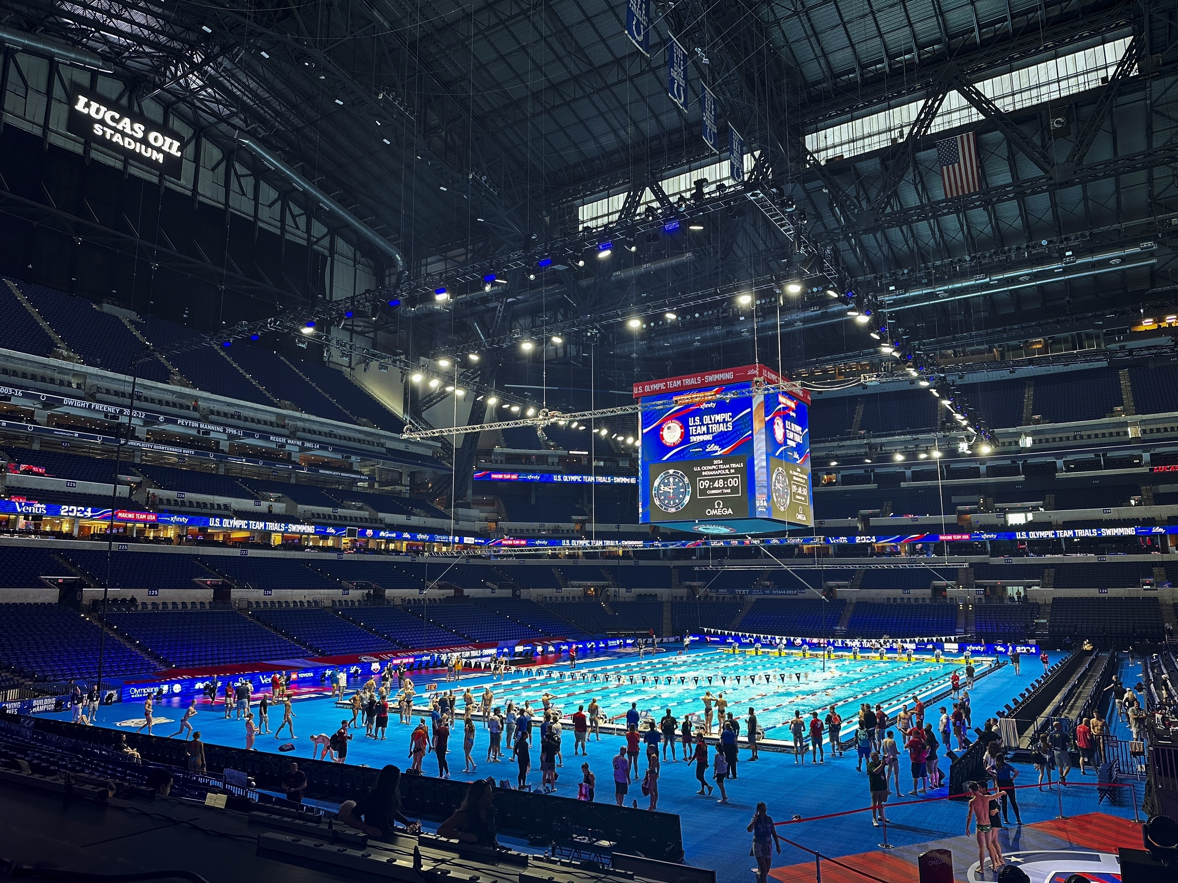 FILE - Swimmers practice in the Olympic pool inside Lucas Oil Stadium, June 15, 2024, at the U.S. Swimming Olympic Trials in Indianapolis. 