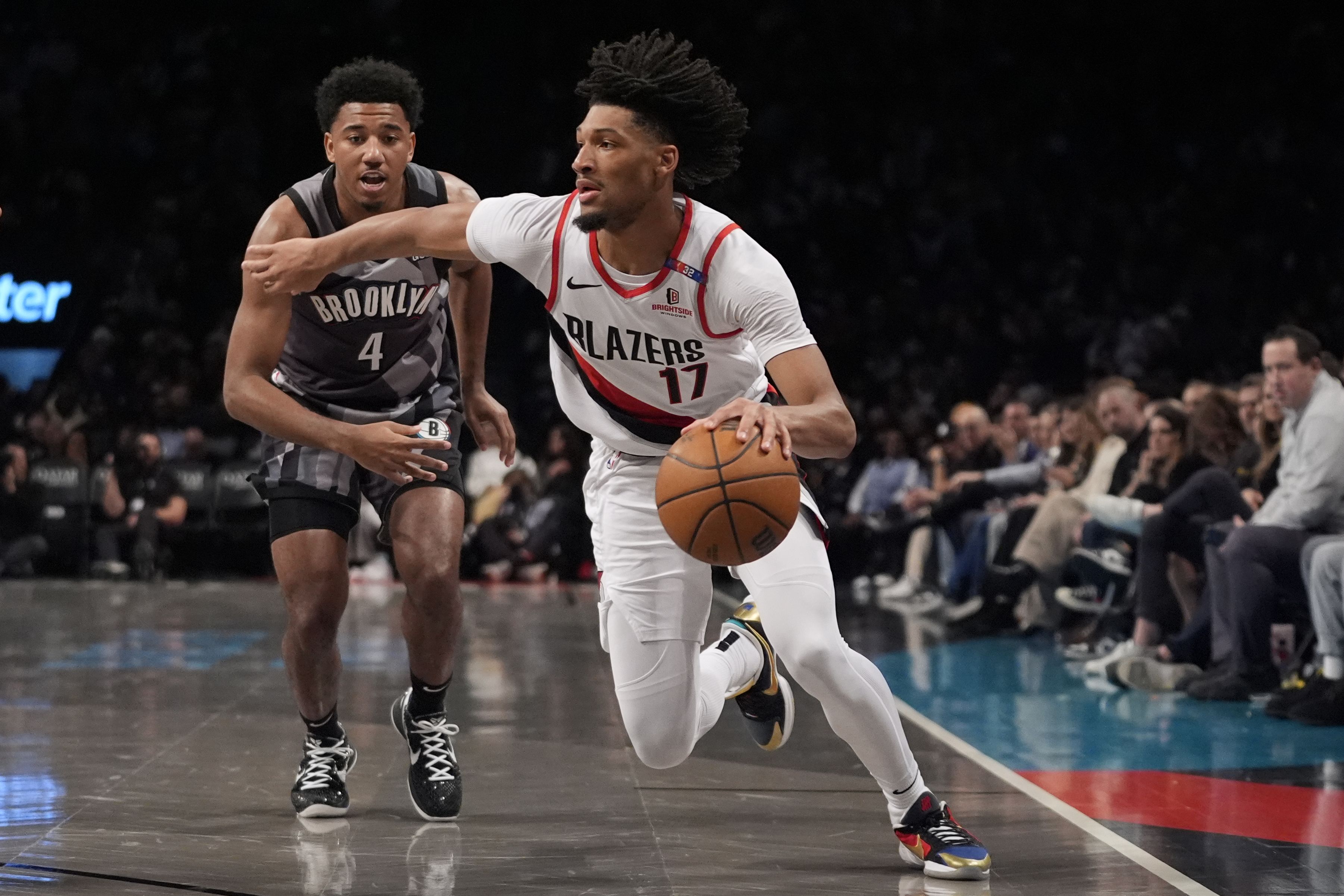 Portland Trail Blazers' Shaedon Sharpe (17) drives past Brooklyn Nets' Reece Beekman (4) during the first half of an NBA basketball game Friday, Feb. 28, 2025, in New York.