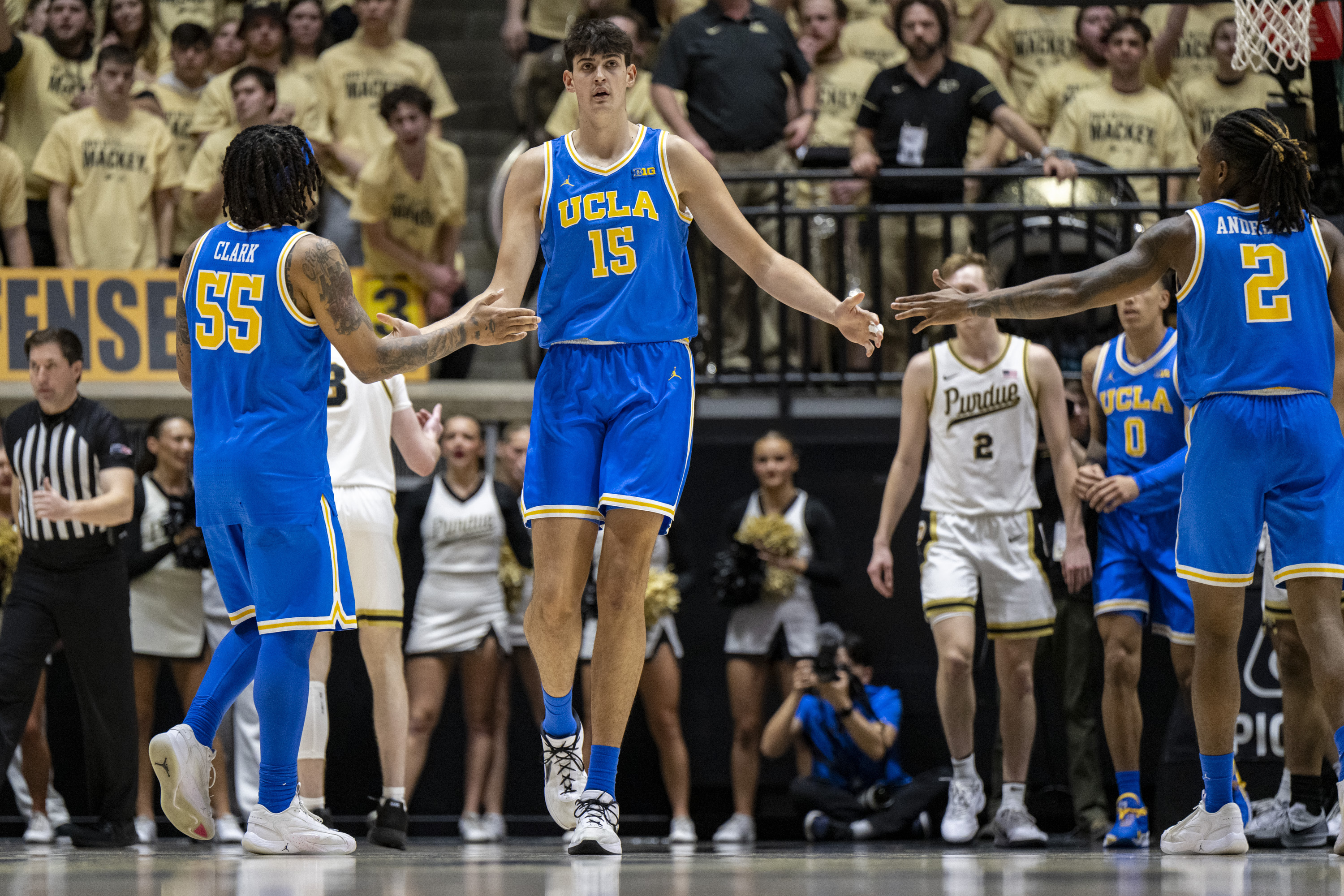 UCLA center Aday Mara (15) reacts with teammates after scoring during the second half of an NCAA college basketball game against Purdue, Friday, Feb. 28, 2025, in West Lafayette, Ind. 