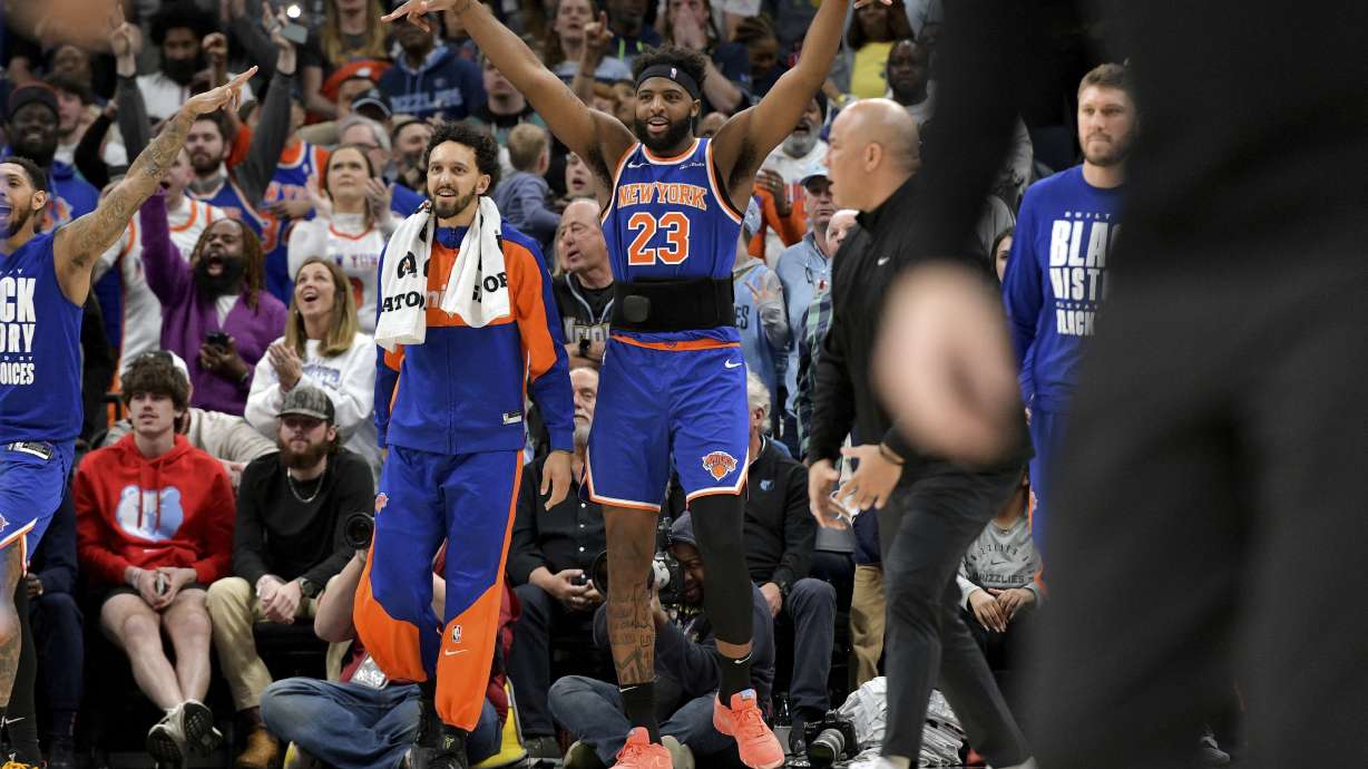 New York Knicks center Mitchell Robinson (23) reacts with teammates in the second half of an NBA basketball game against the Memphis Grizzlies Friday, Feb. 28, 2025, in Memphis, Tenn.