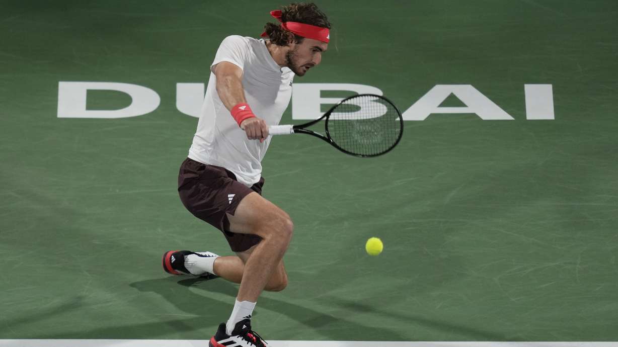 Stefanos Tsitsipas of Greece returns the ball to Felix Auger-Aliassime of Canada during the men's singles final match of Dubai Duty Free Tennis Championship in Dubai, United Arab Emirates, on Saturday, March 1, 2025.