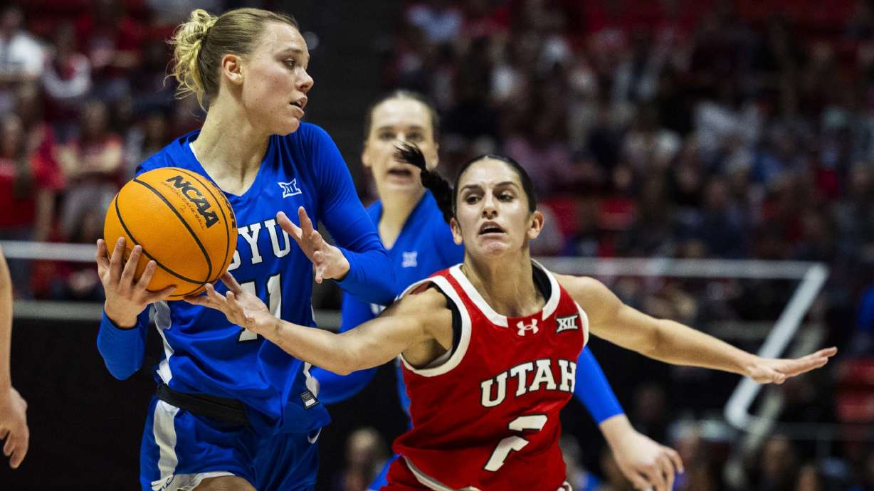 Utah Utes guard Ines Vieira (2) attempts to steal the ball from BYU Cougars guard Delaney Gibb (11) during a basketball game at the Jon M. Huntsman Center on the campus of the University of Utah in Salt Lake City on Saturday, March 1, 2025.
