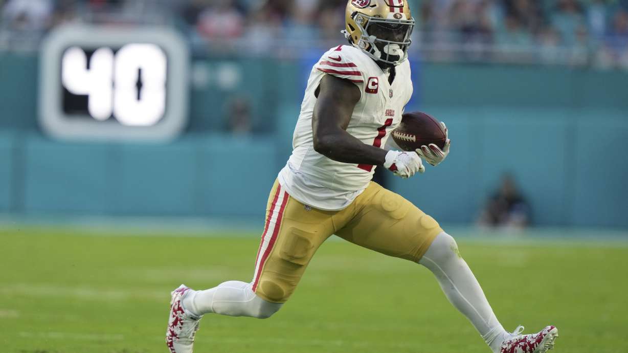 FILE - San Francisco 49ers wide receiver Deebo Samuel Sr. (1) runs for a first down during the first half of an NFL football game against the Miami Dolphins, Dec. 22, 2024, in Miami Gardens, Fla.