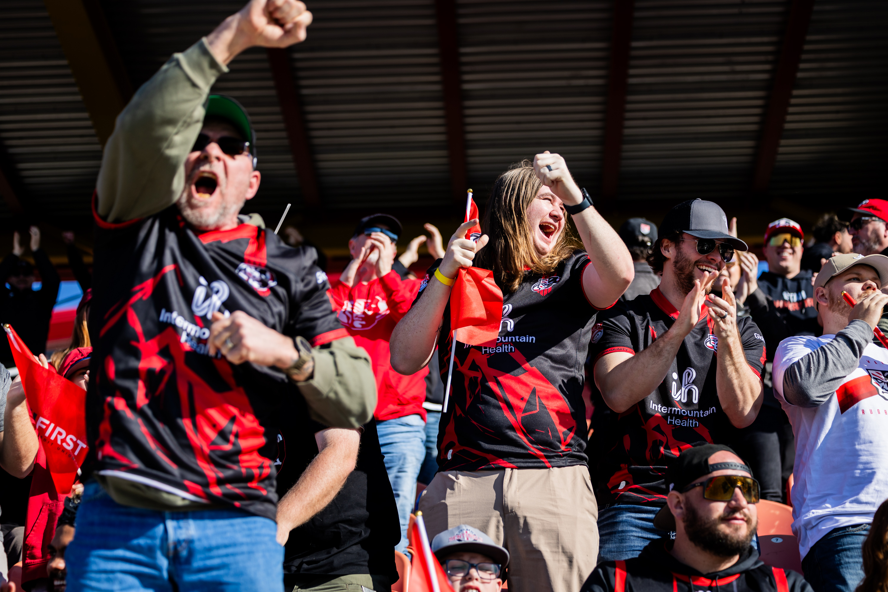 Utah Warrior fans celebrate after the Utah Warriors scored a try in a rugby match against the NOLA Gold held at the Zions Bank Stadium in Herriman on Saturday, March 1, 2025.