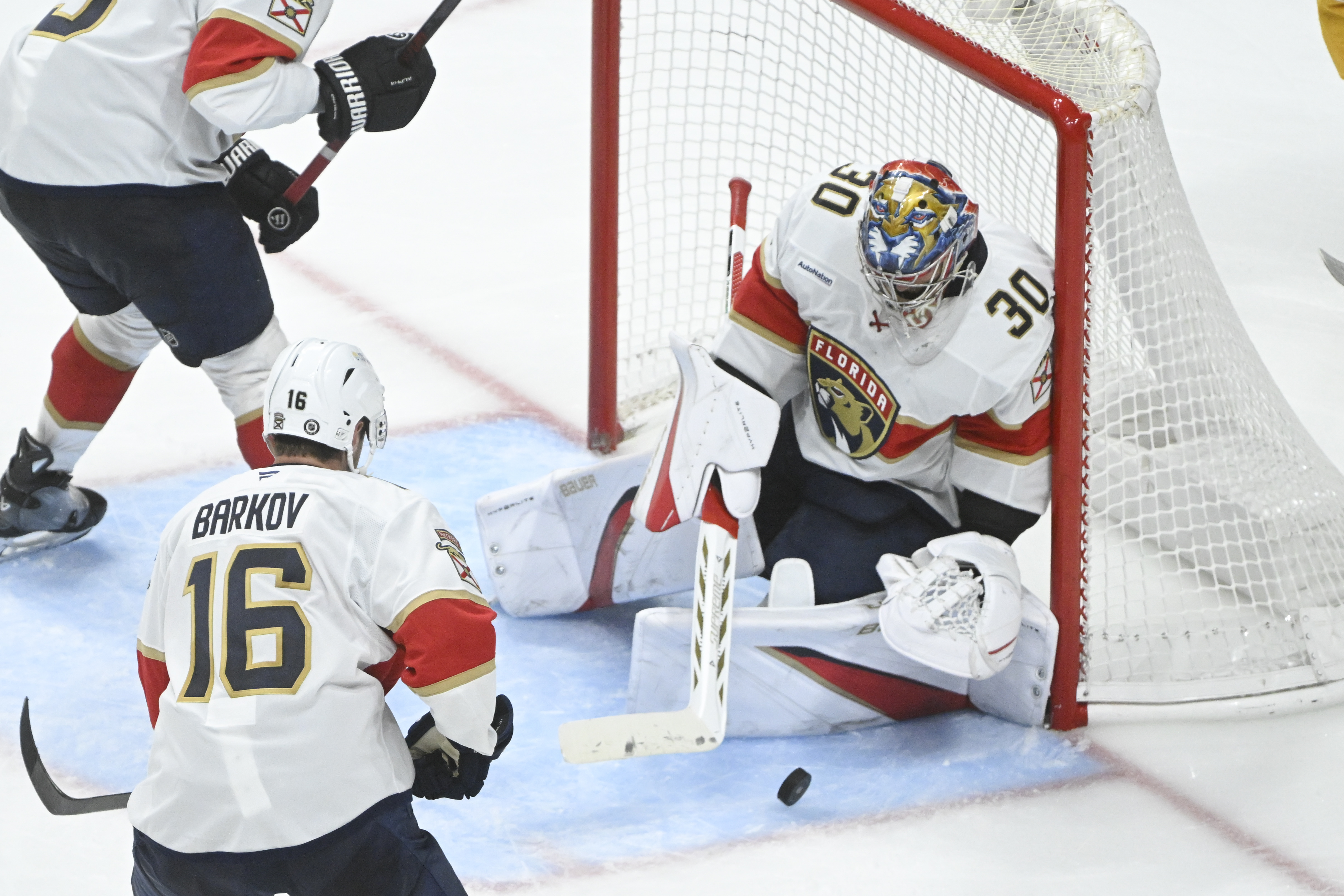Florida Panthers goaltender Spencer Knight (30) makes a save against the Nashville Predators during the third period of an NHL hockey game Tuesday, Feb. 25, 2025, in Nashville, Tenn. 