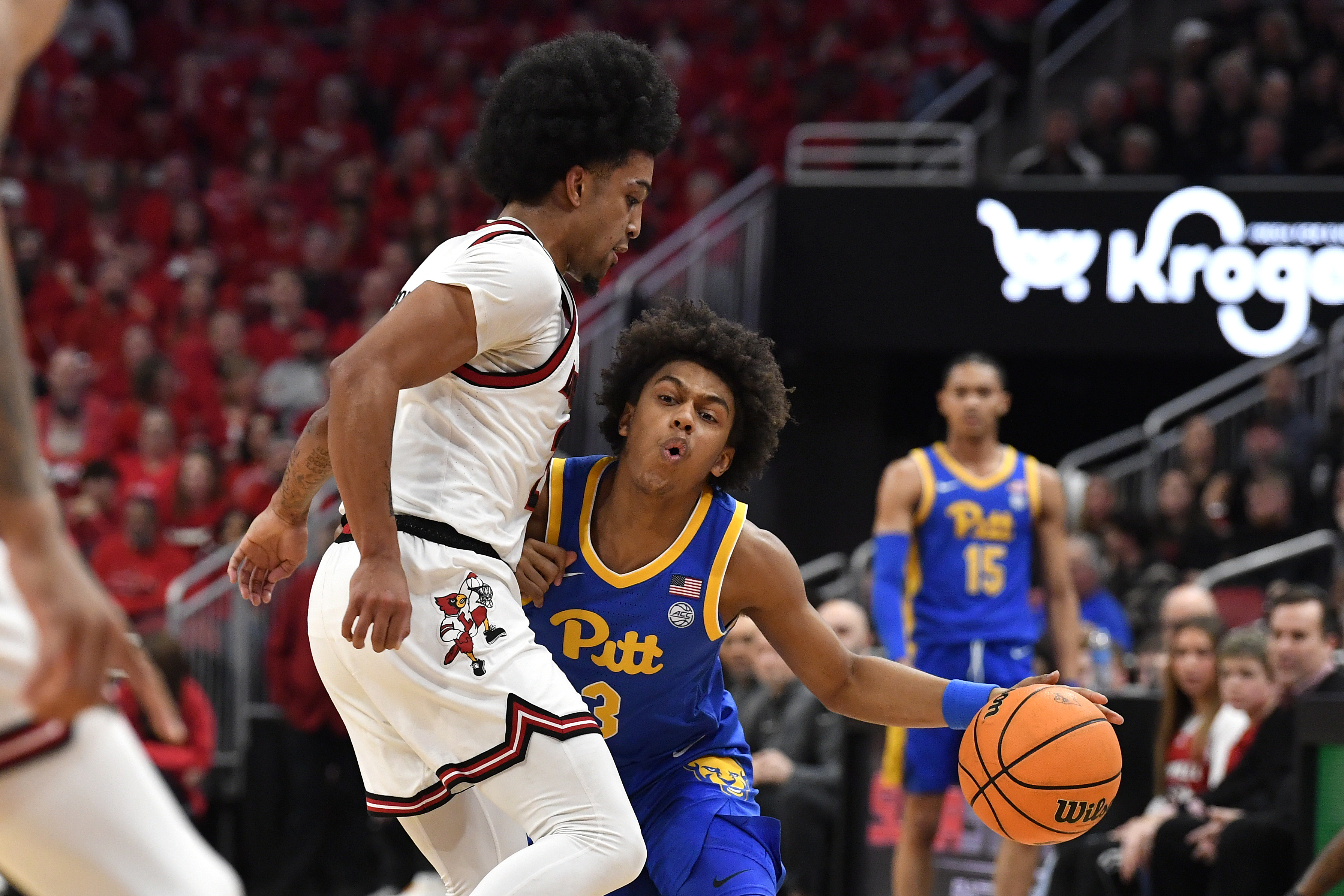 Pittsburgh guard Brandin Cummings (3) runs into Louisville guard Chucky Hepburn as he attempts to drive to the basket during the first half of an NCAA college basketball game in Louisville, Ky., Saturday, March 1, 2025. 
