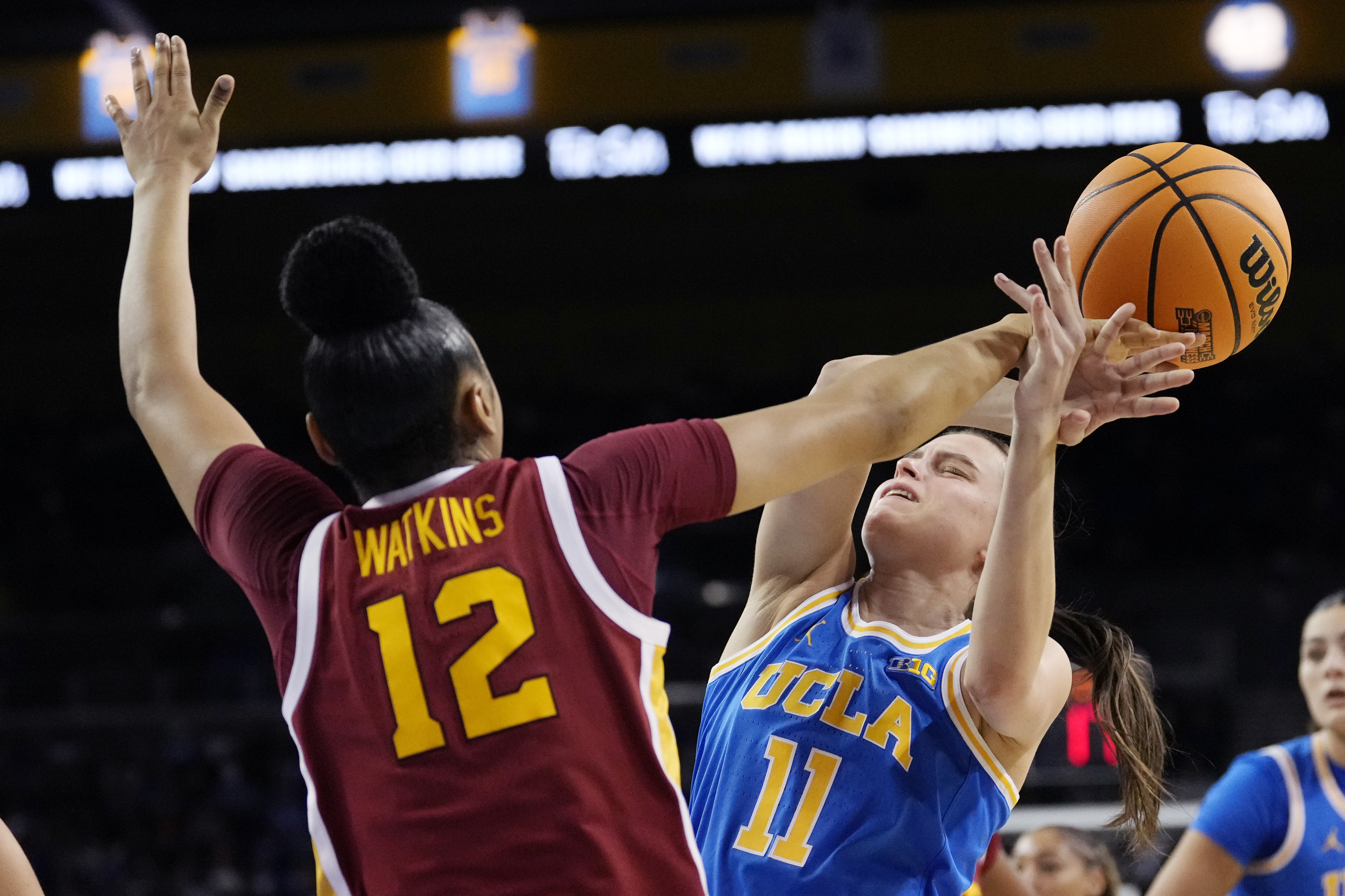 Southern California guard JuJu Watkins, left, blocks the shot of UCLA guard Gabriela Jaquez during the first half of an NCAA college basketball game Saturday, March 1, 2025, in Los Angeles. 
