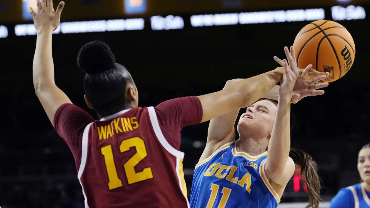 Southern California guard JuJu Watkins, left, blocks the shot of UCLA guard Gabriela Jaquez during the first half of an NCAA college basketball game Saturday, March 1, 2025, in Los Angeles.