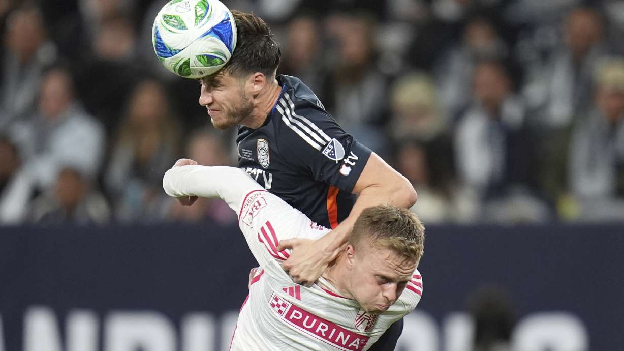 San Diego FC defender Paddy McNair, heads a ball on goal as St. Louis City defender Tomas Totland defends during the second half of an MLS soccer match Saturday, March 1, 2025, in San Diego.