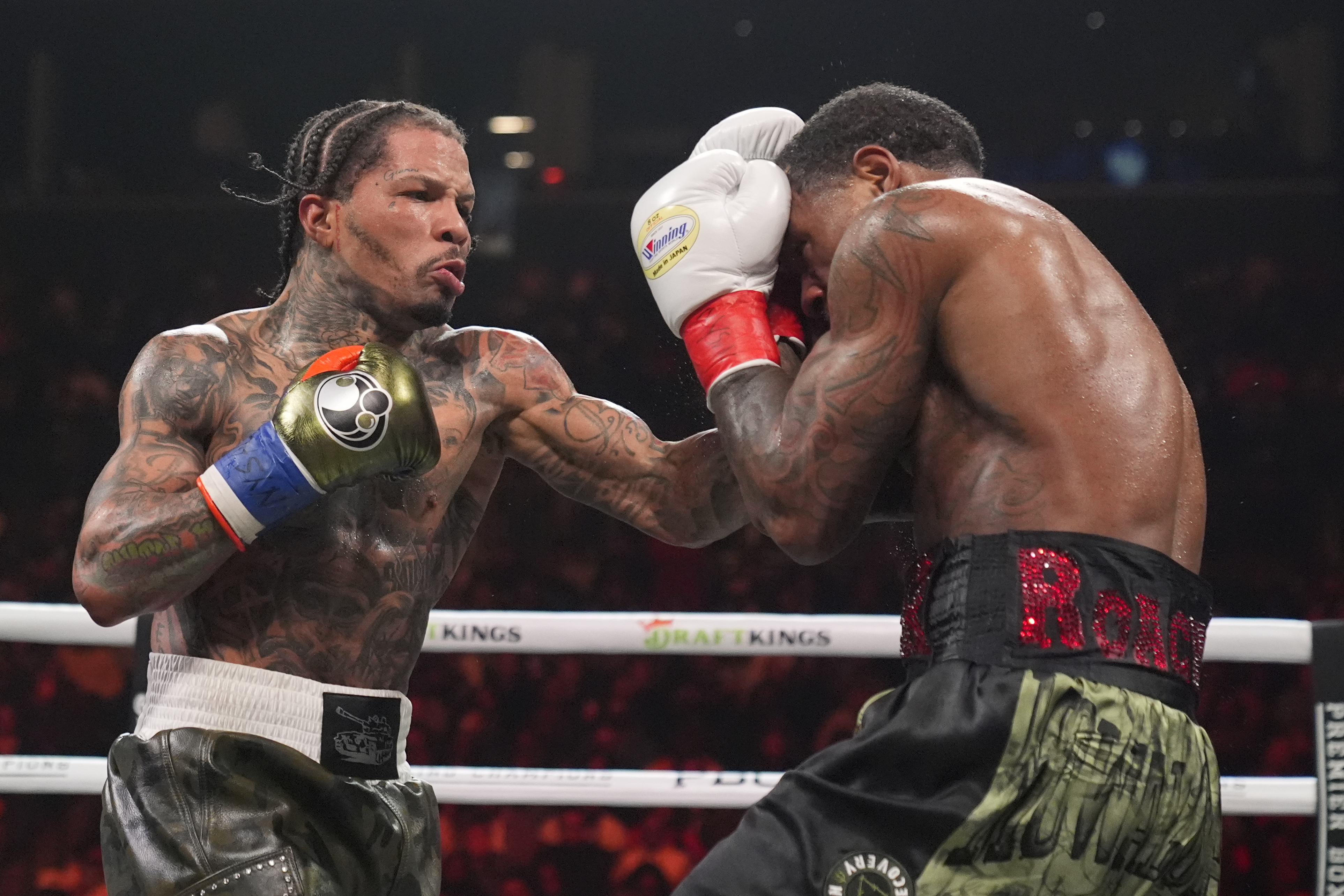 Gervonta Davis, left, punches Lamont Roach during the sixth round of a WBA lightweight championship boxing bout Sunday, March 2, 2025, in New York. 