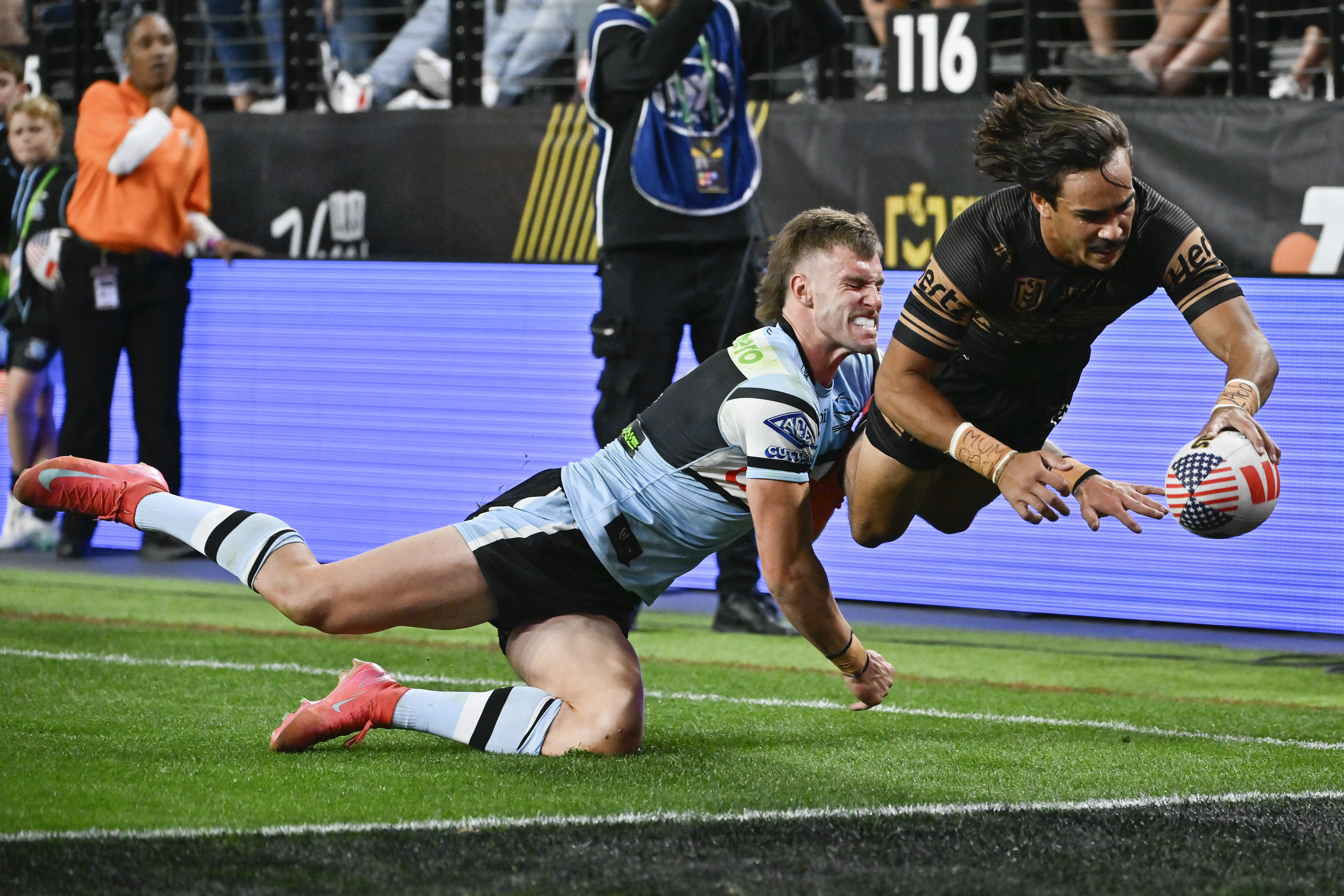 Penrith Panthers Daine Laurie dives across the line to score a try during Australia's National Rugby League game between the Penrith Panthers and Cronulla Sutherland-Sharks at Allegiant Stadium in Las Vegas, Saturday, March 1, 2025. 