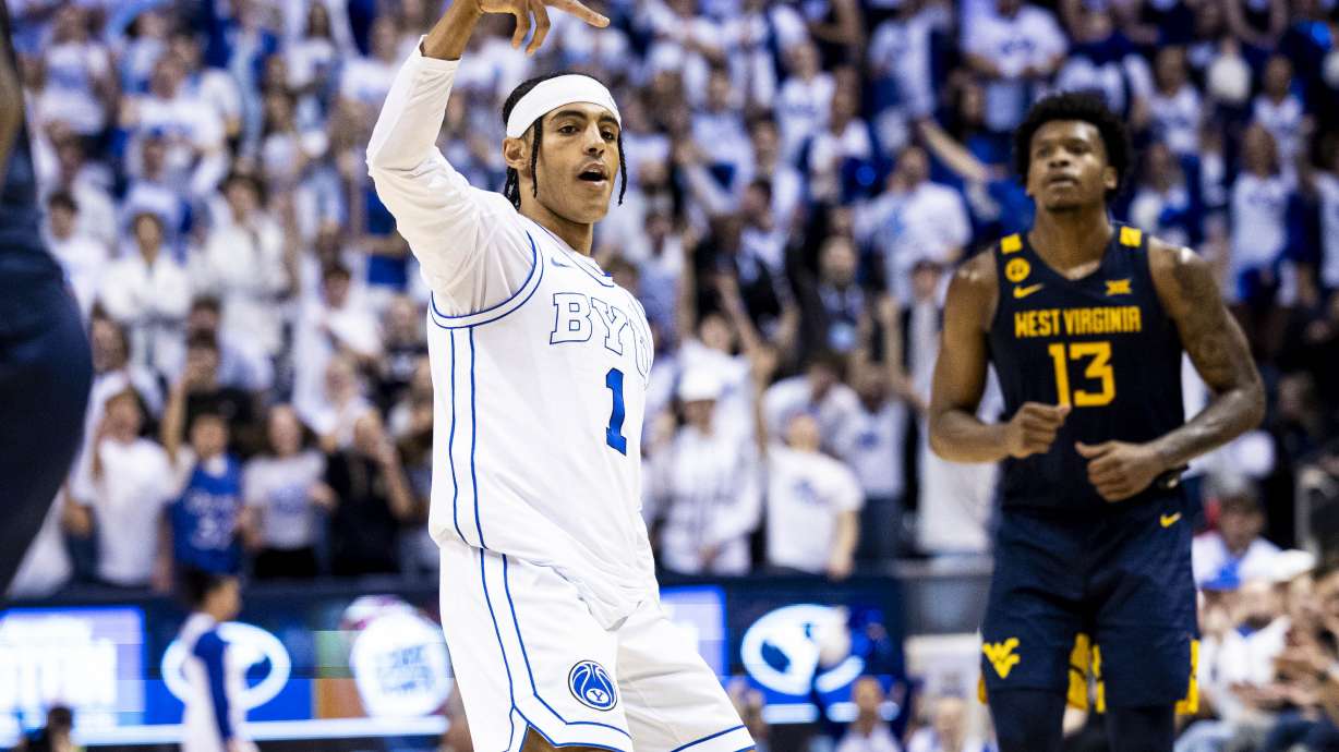 BYU guard Trey Stewart (1) celebrates his three-pointer against the West Virginia Mountaineers during an NCAA men’s basketball game held at the Marriott Center in Provo on Saturday, March 1, 2025.