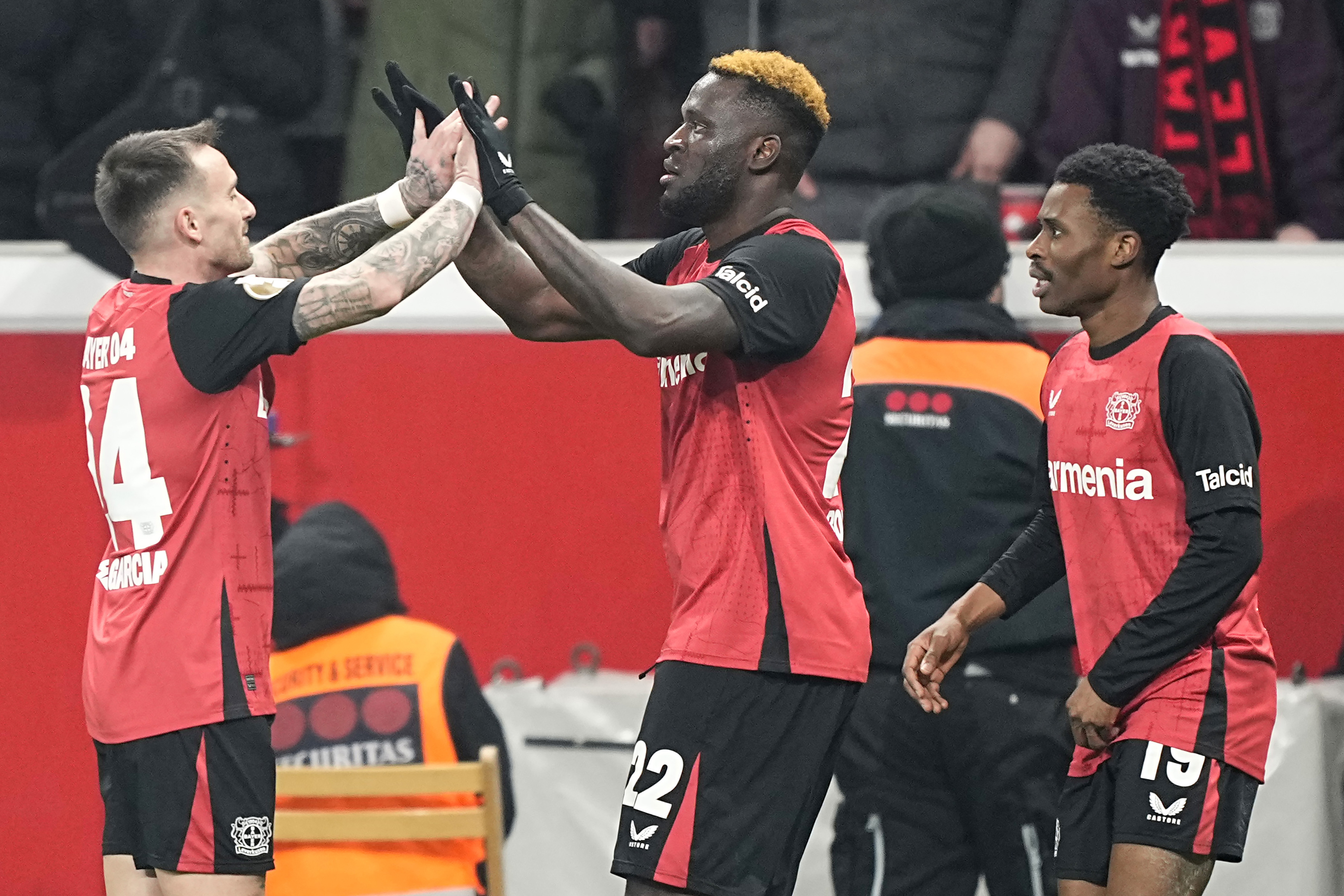FILE - Leverkusen's Victor Boniface, center, celebrates with his teammates after scoring the third goal against Cologne during the German Cup quarterfinal soccer match between Bayer Leverkusen and FC Cologne at the BayArena in Leverkusen, Germany, on Feb. 5, 2025. 