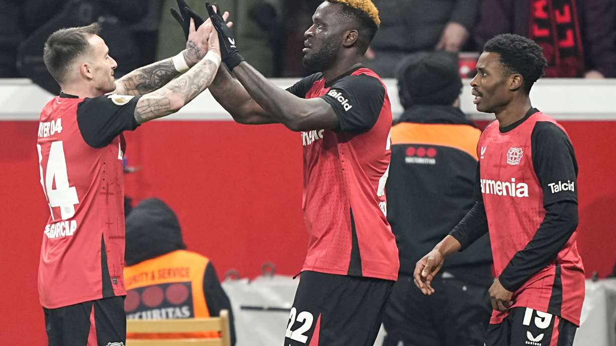 FILE - Leverkusen's Victor Boniface, center, celebrates with his teammates after scoring the third goal against Cologne during the German Cup quarterfinal soccer match between Bayer Leverkusen and FC Cologne at the BayArena in Leverkusen, Germany, on Feb. 5, 2025.